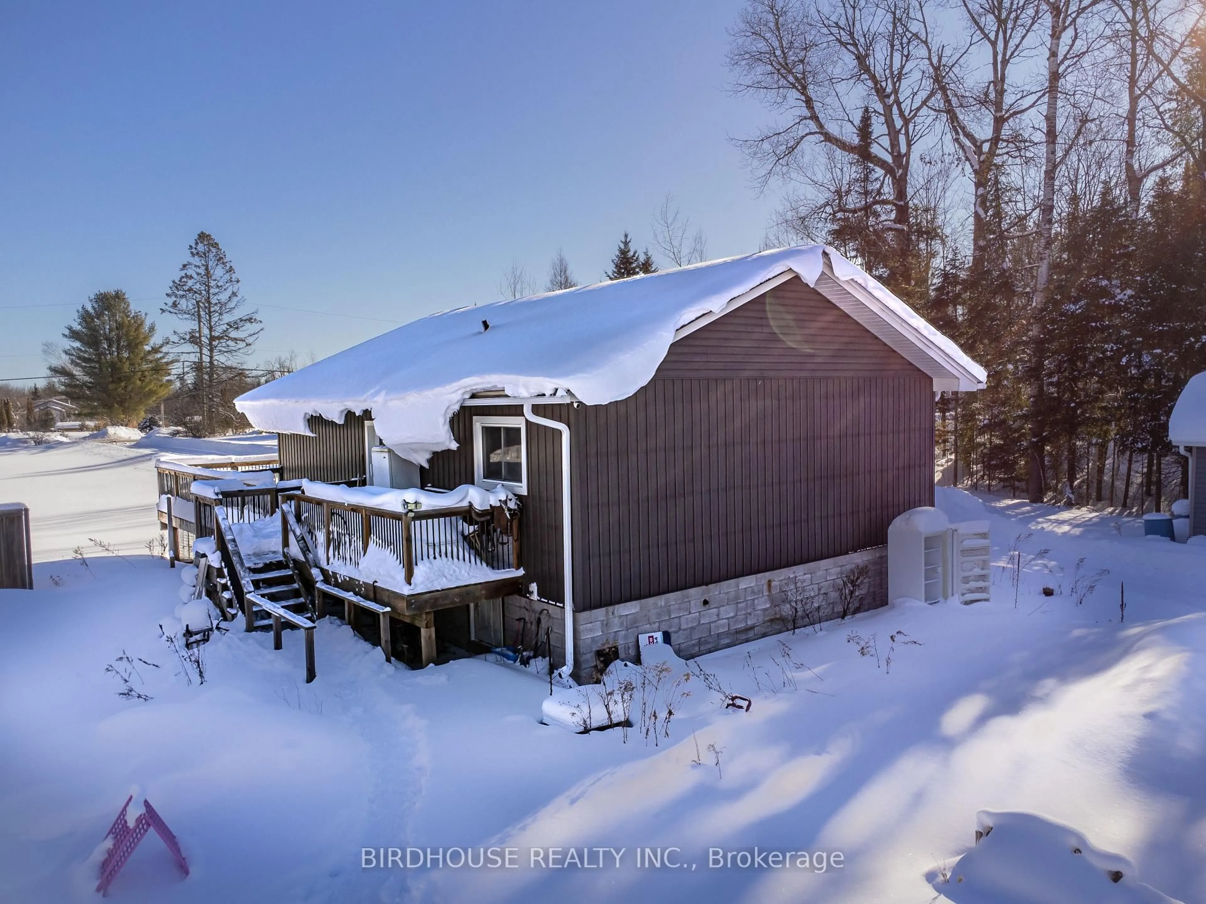 A pic from outside/outdoor area/front of a property/back of a property/a pic from drone, street for 3399 Gelert Rd, Minden Hills Ontario K0M 2K0