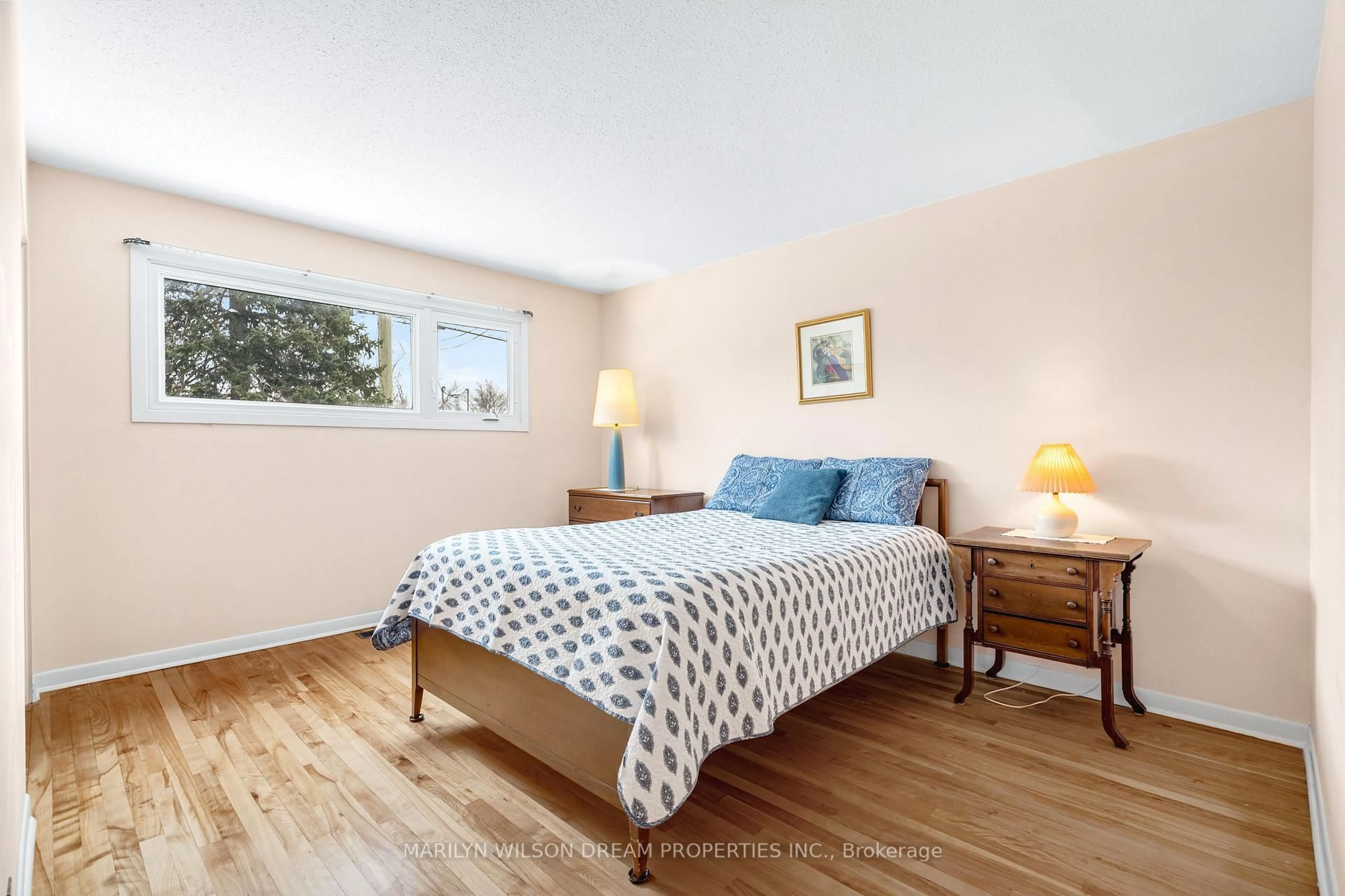 Bedroom with bed, wood/laminate floor for 2422 Magnus Ave, Ottawa Ontario K1G 1J8