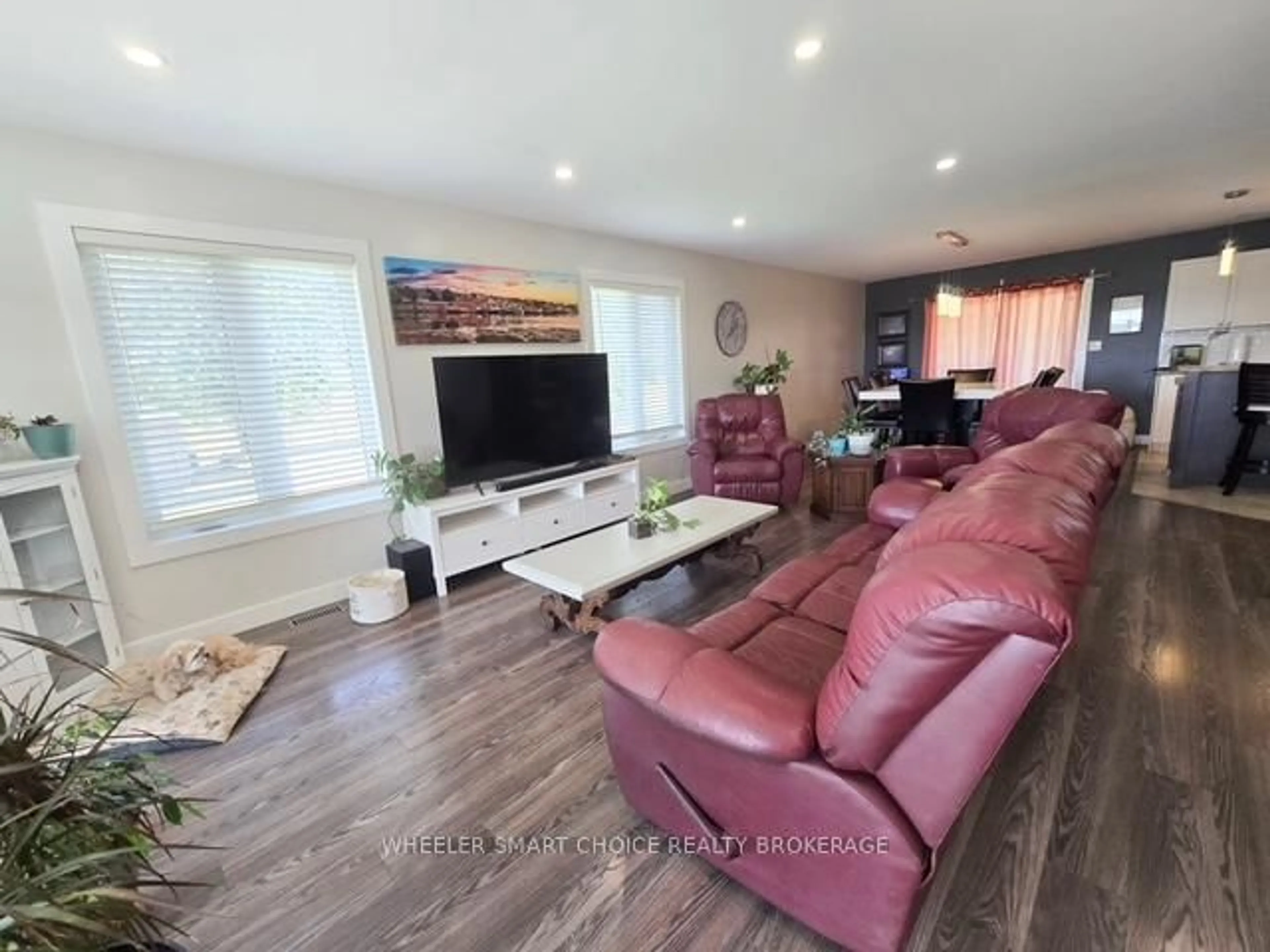 Living room with furniture, wood/laminate floor for 15765 Manning Rd, South Stormont Ontario K0C 1M0