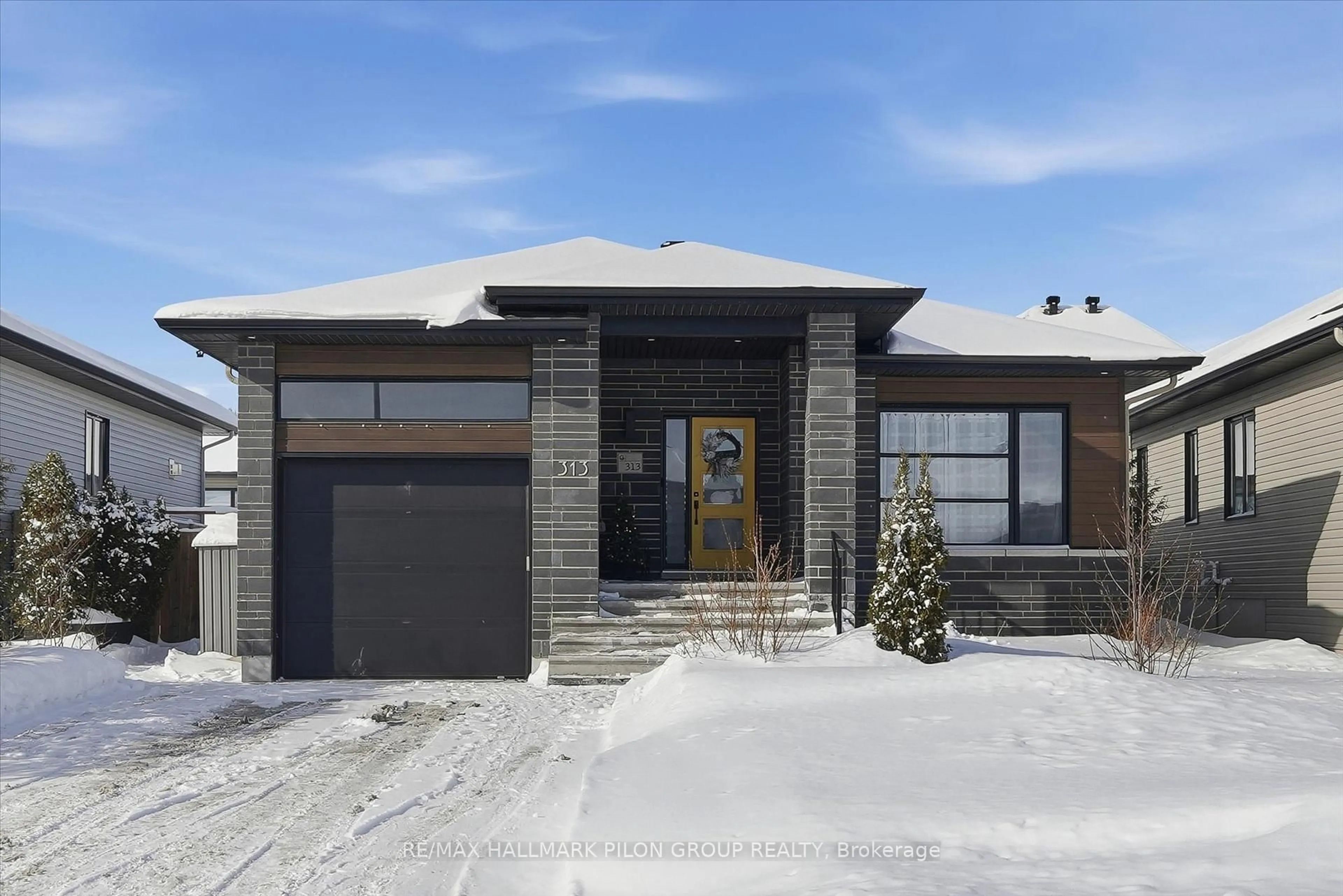 Home with brick exterior material, street for 313 Nature St, Casselman Ontario K0A 1M0