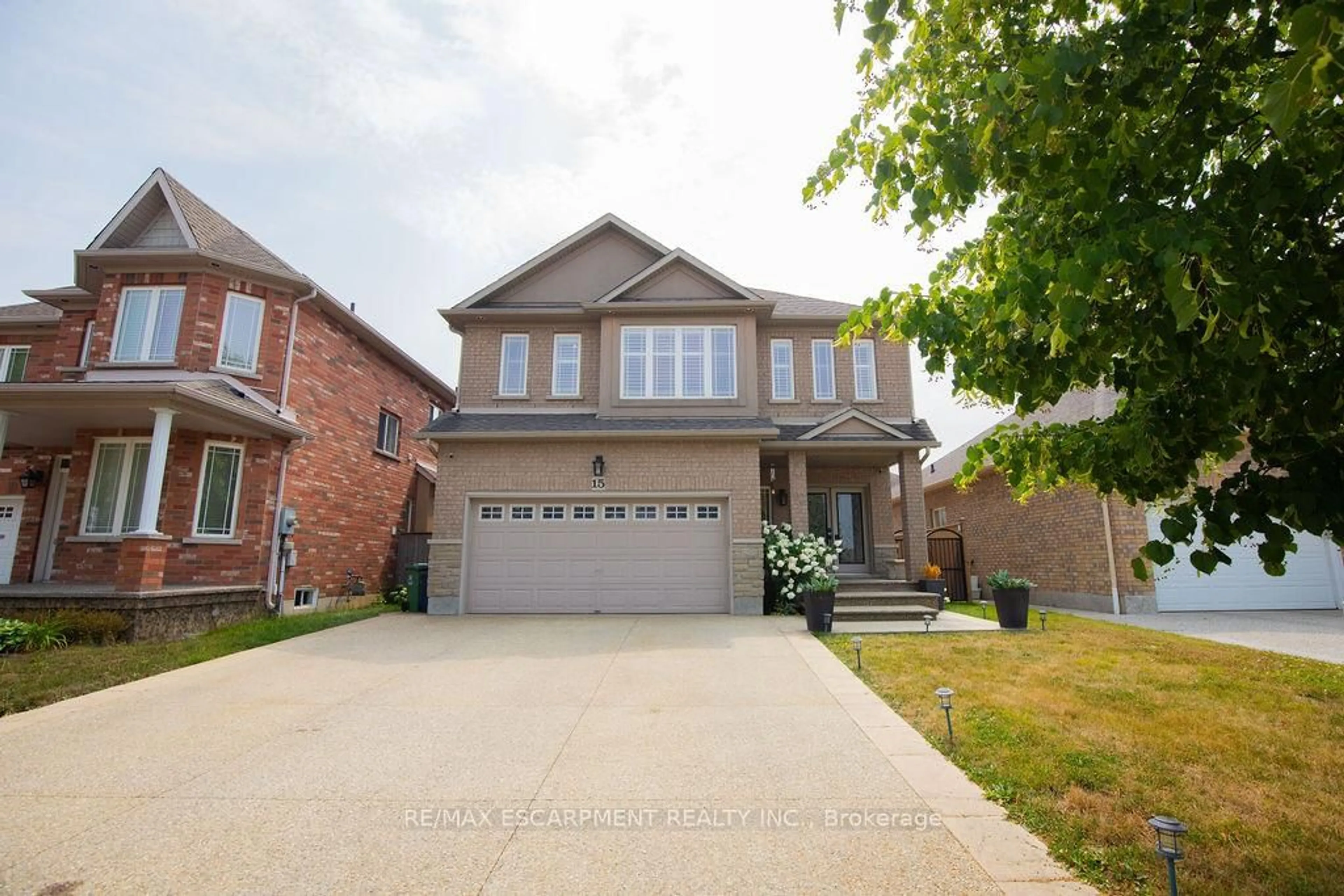 Home with brick exterior material, street for 15 Meadowbank Dr, Hamilton Ontario L9B 2Y9