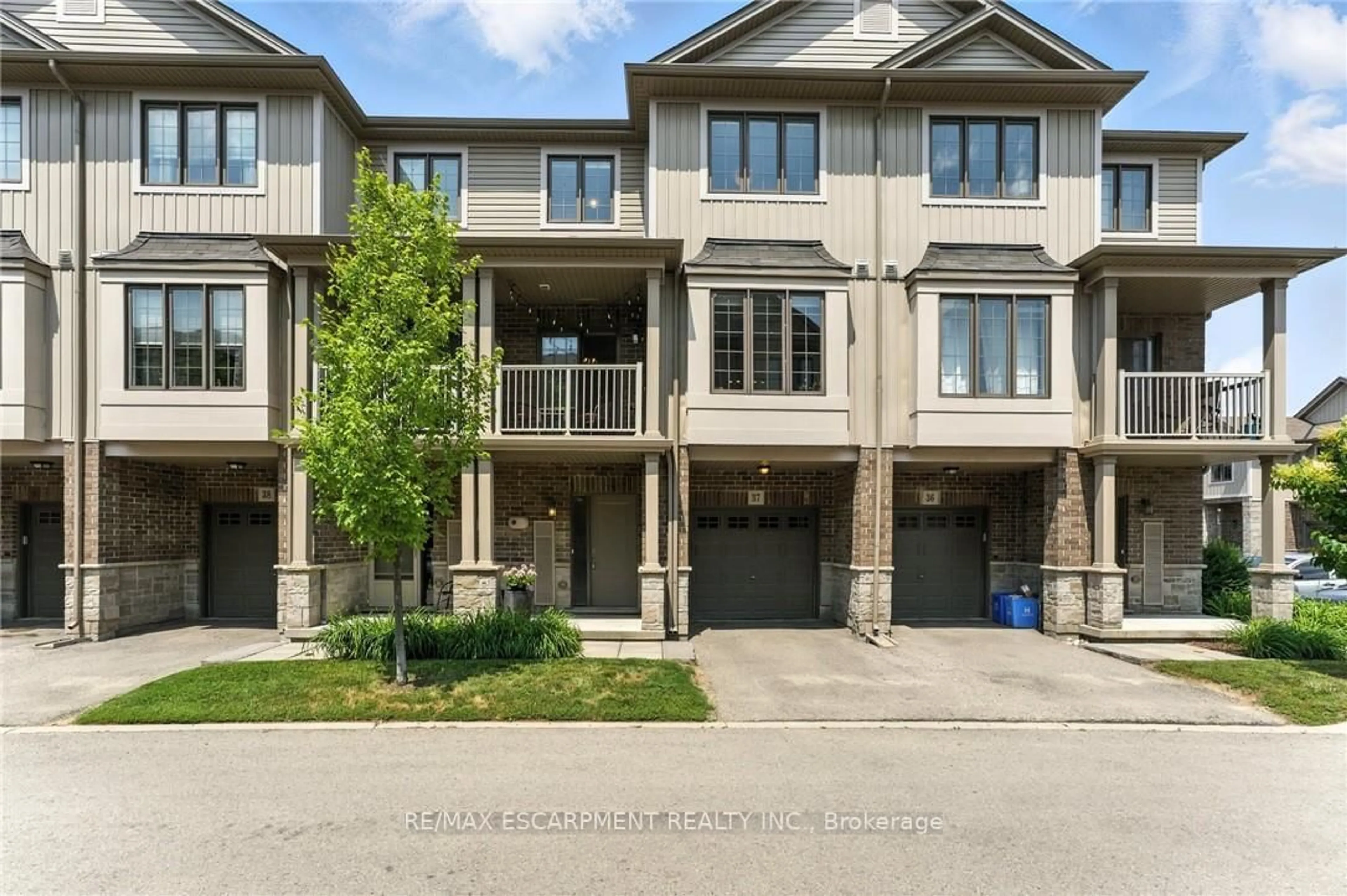 A pic from outside/outdoor area/front of a property/back of a property/a pic from drone, street for 377 Glancaster Rd #37, Hamilton Ontario L9G 0G4