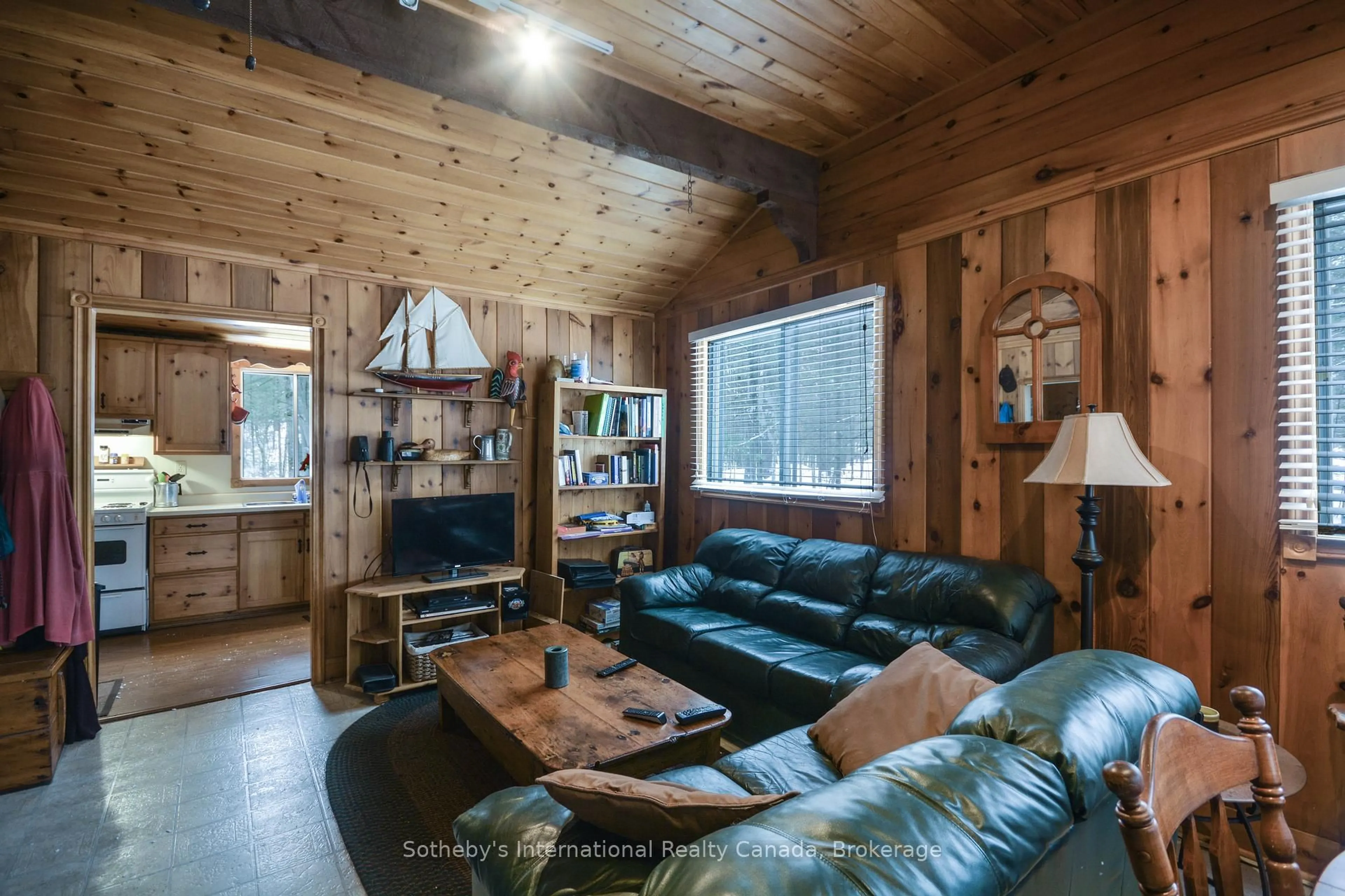 Living room with furniture, wood/laminate floor for 9492 Go Home Lake Shore, Georgian Bay Ontario P0C 1H0