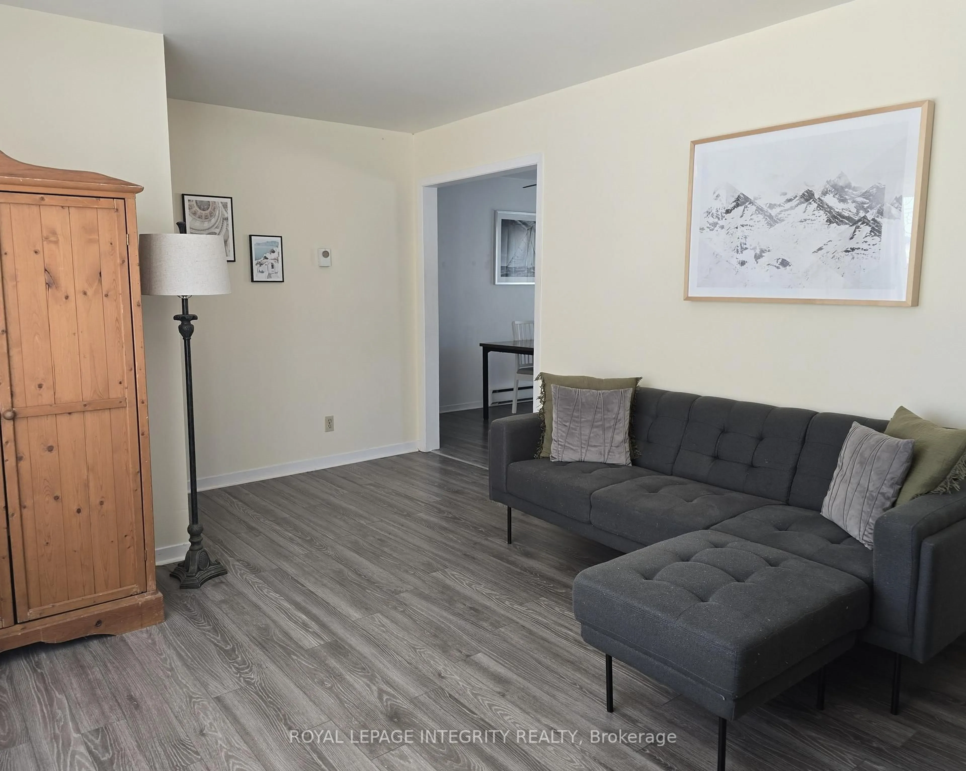 Living room with furniture, wood/laminate floor for 3264 Johnston Ave, Cornwall Ontario K6K 1H3