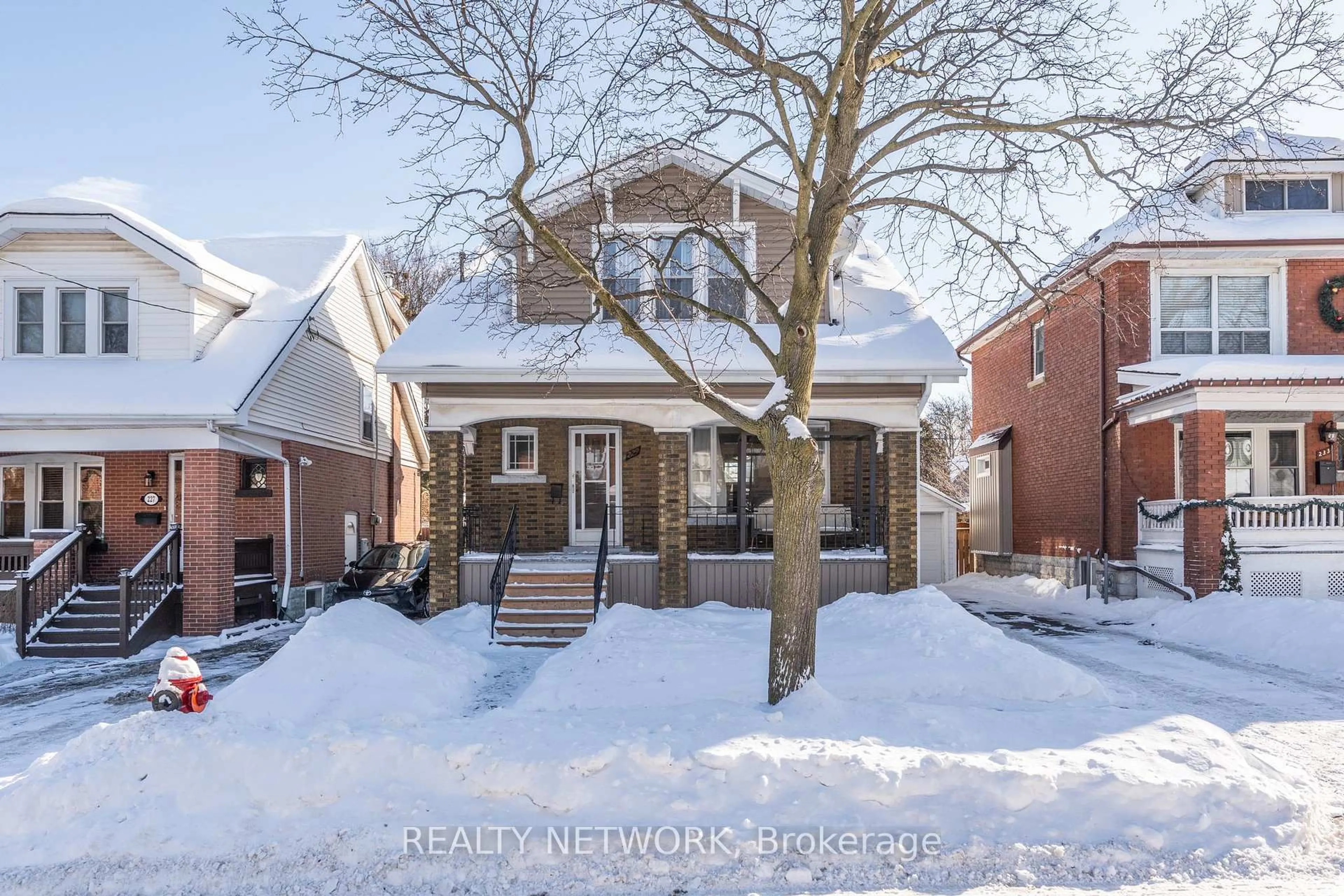 Home with brick exterior material, street for 229 Park Row, Hamilton Ontario L8K 2K4