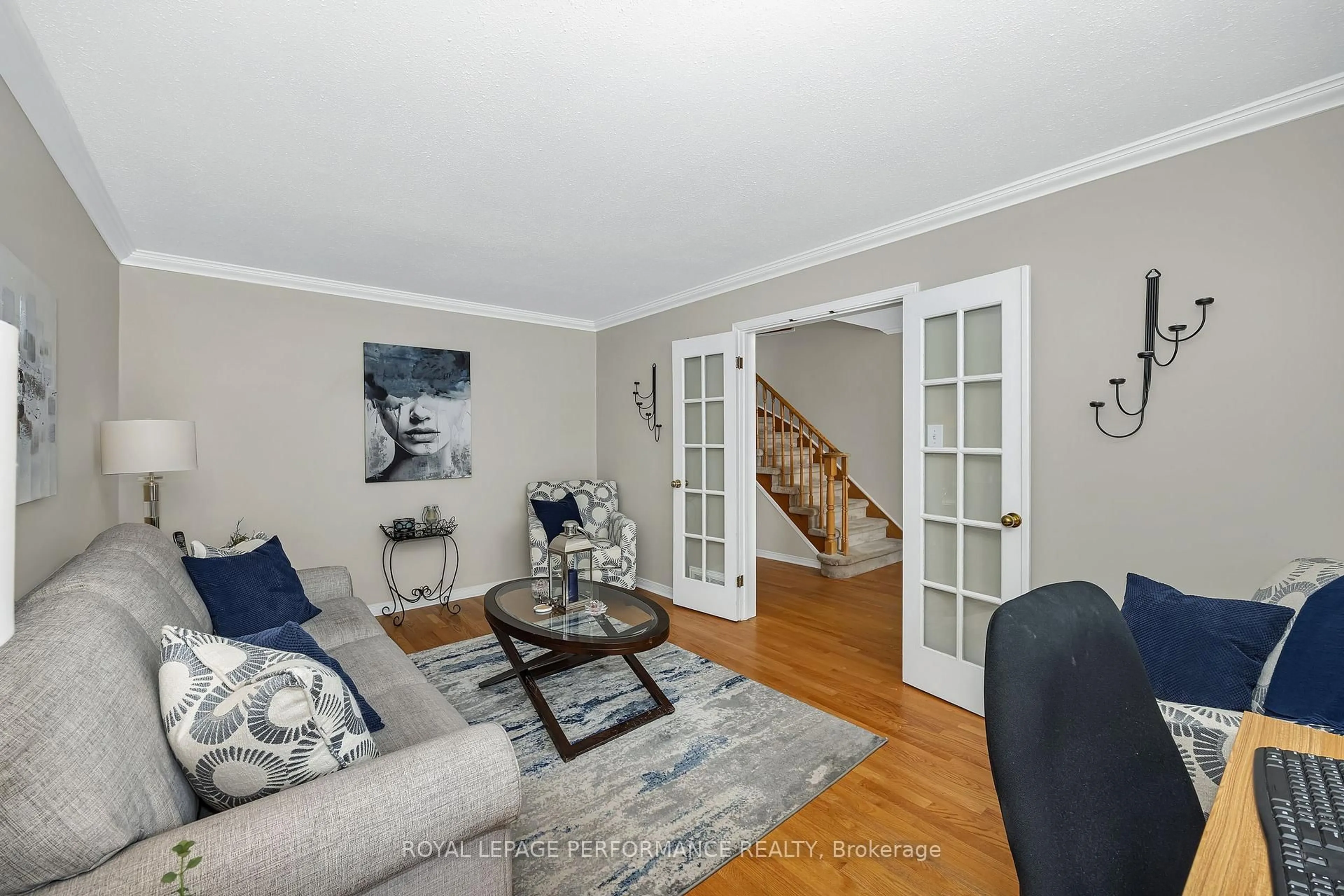 Living room with furniture, wood/laminate floor for 1391 Mountainside Cres, Orleans Ontario K1E 3H6