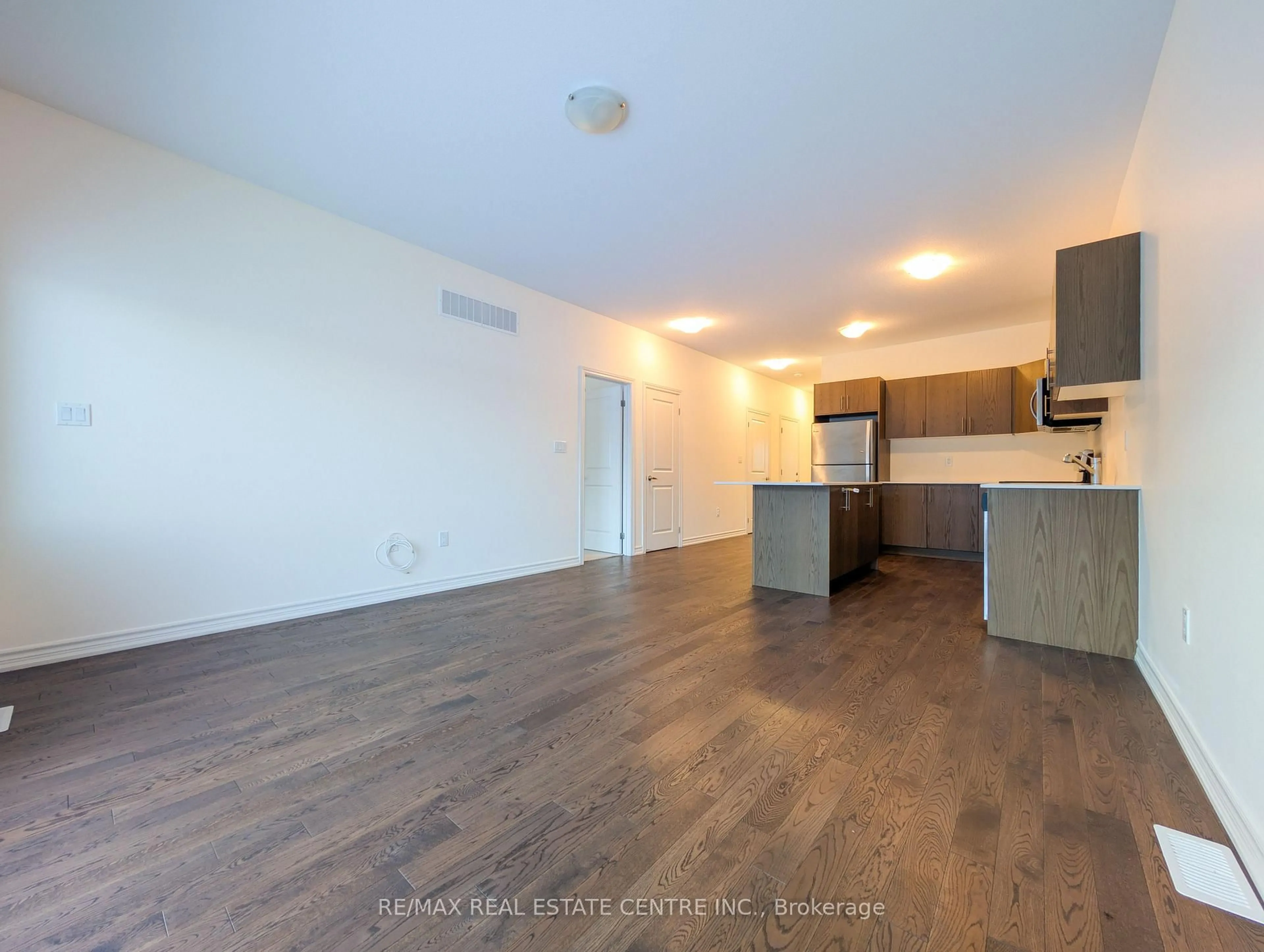 Open concept kitchen, wood/laminate floor for 107 Cheryl Ave, North Perth Ontario N0G 1B0