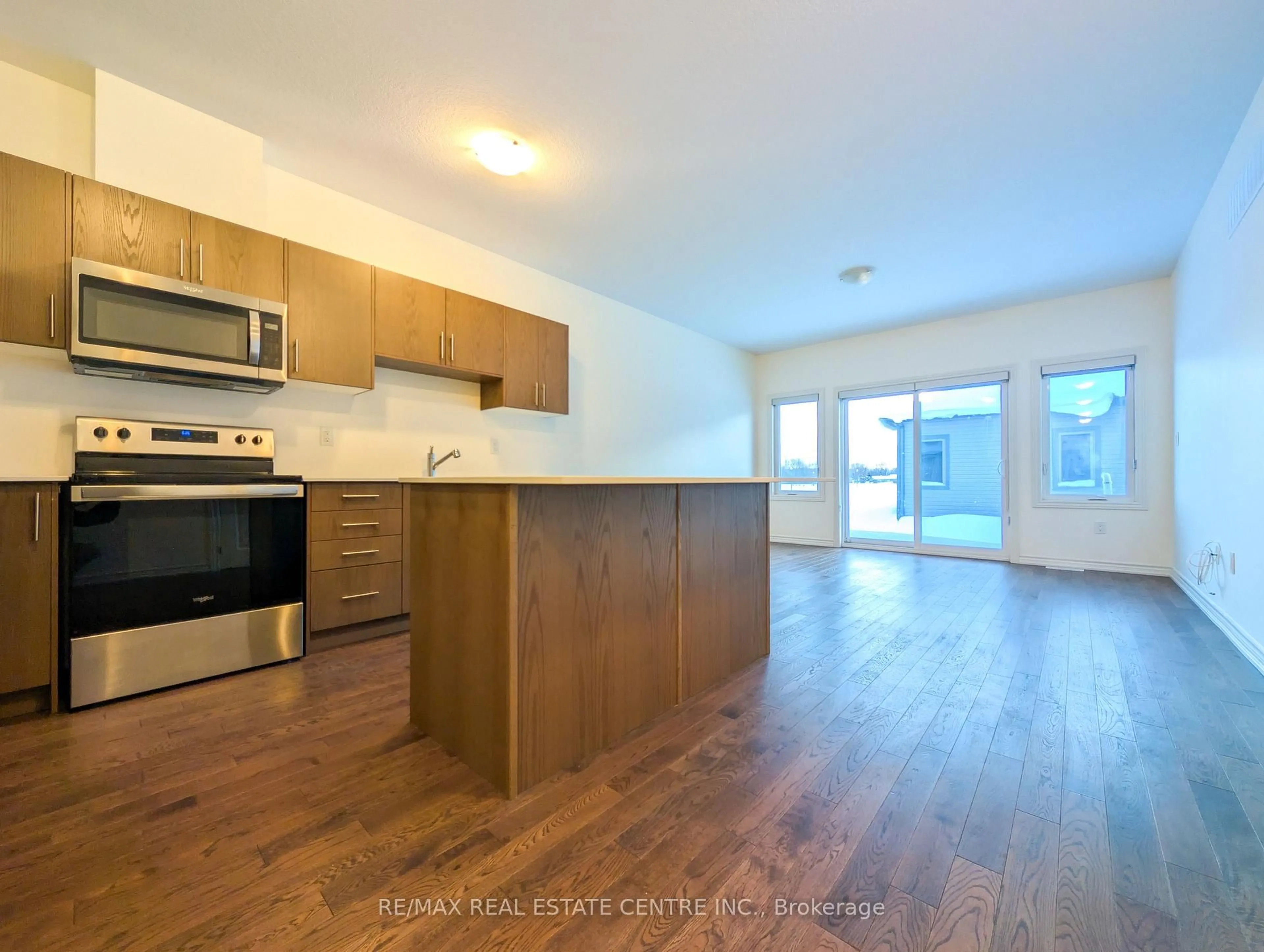 Open concept kitchen, wood/laminate floor for 107 Cheryl Ave, North Perth Ontario N0G 1B0
