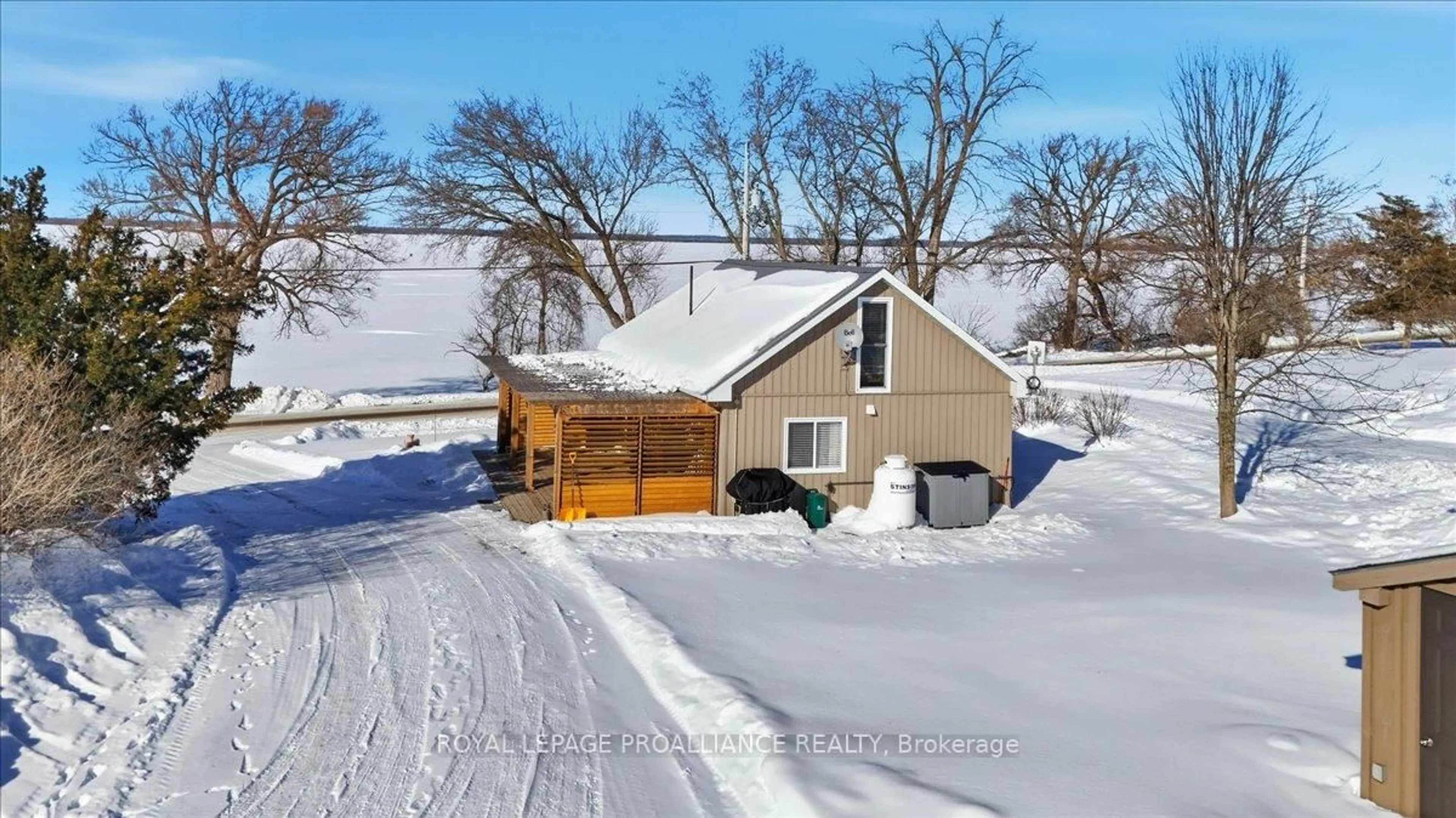 A pic from outside/outdoor area/front of a property/back of a property/a pic from drone, street for 880 North Big Island Rd, Prince Edward County Ontario K0K 1W0