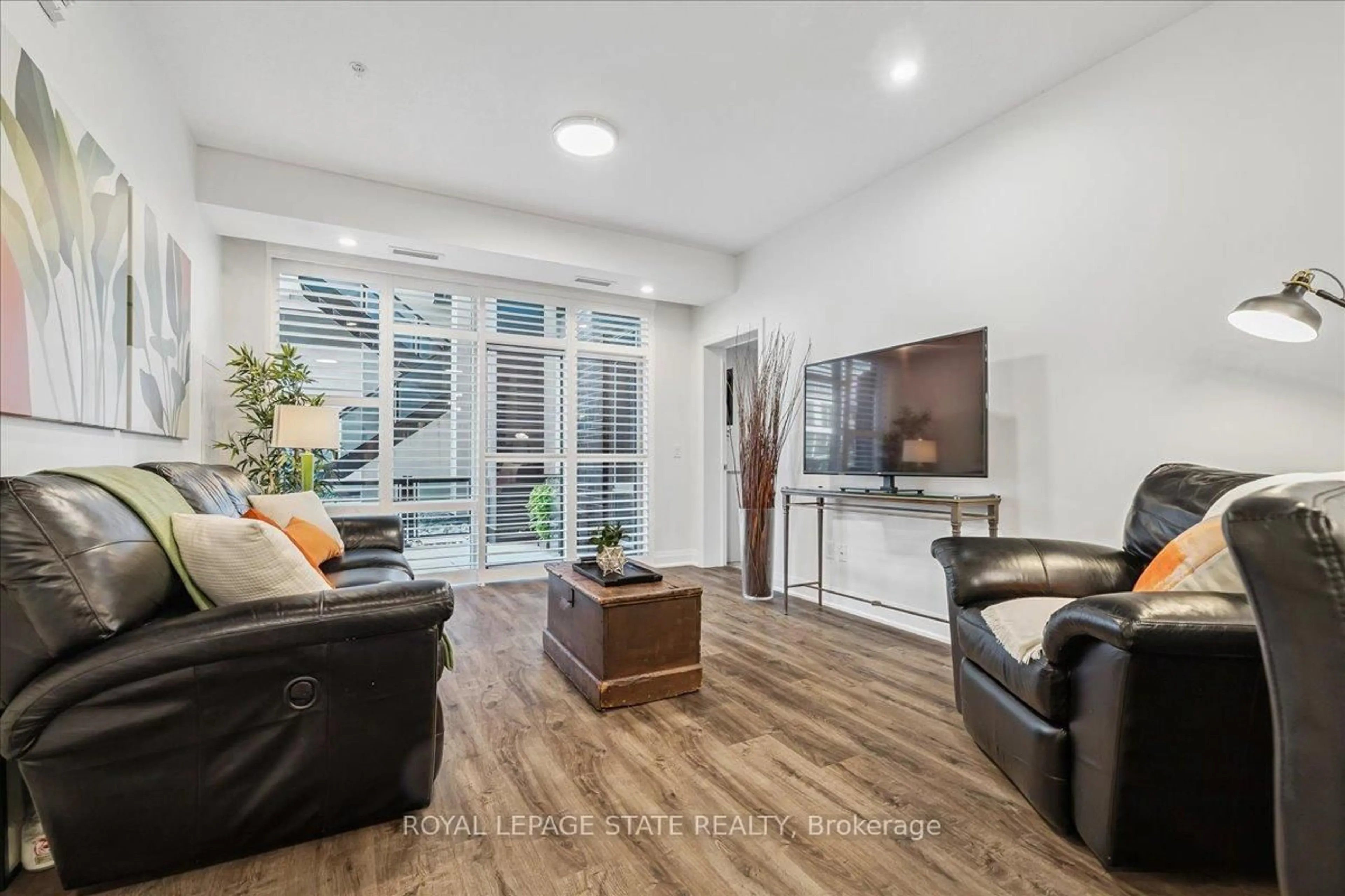 Living room with furniture, unknown for 16 Concord Pl #150, Grimsby Ontario L3M 0J1