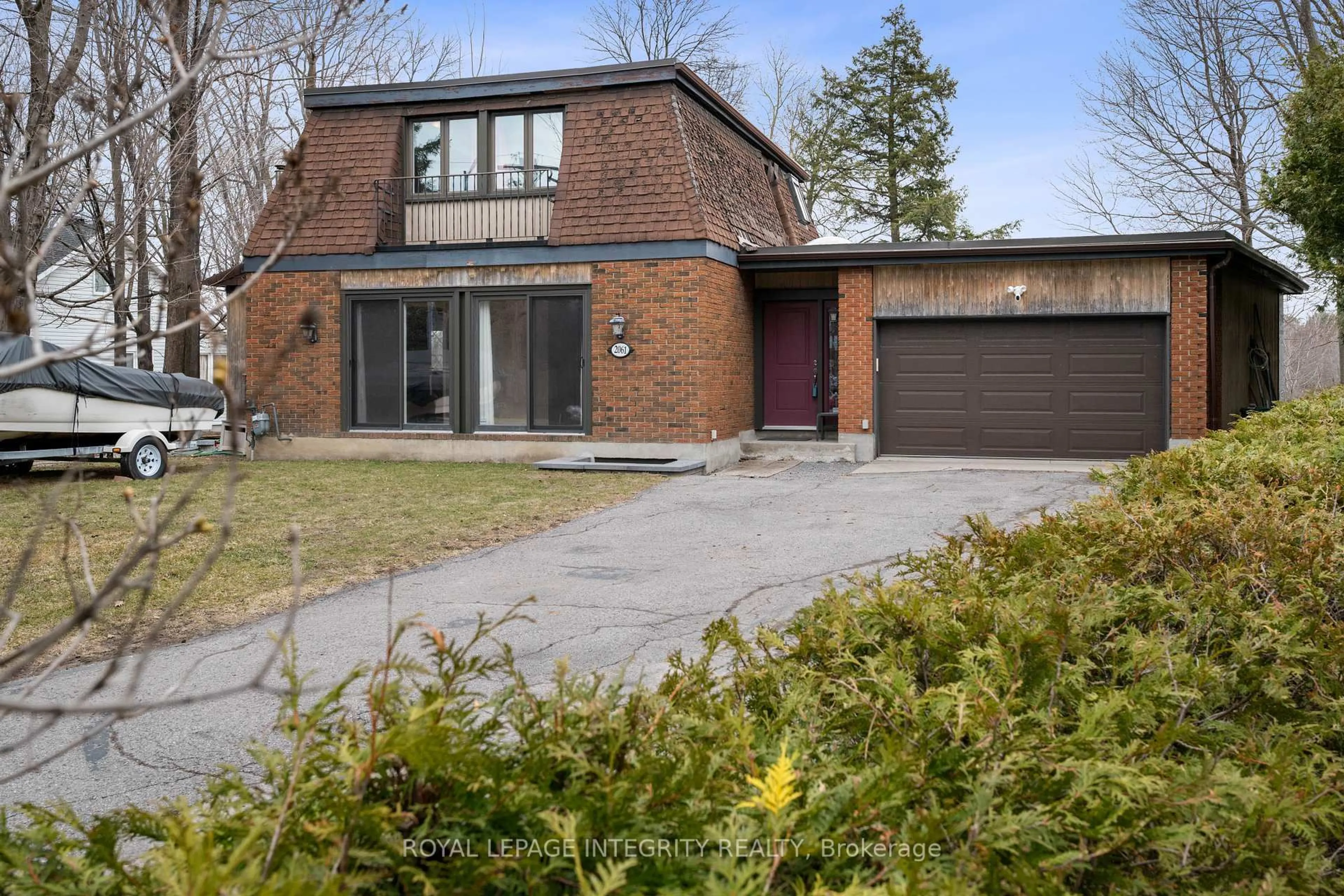 Home with brick exterior material, street for 2061 Prince Of Wales Dr, Ottawa Ontario K2E 7A4