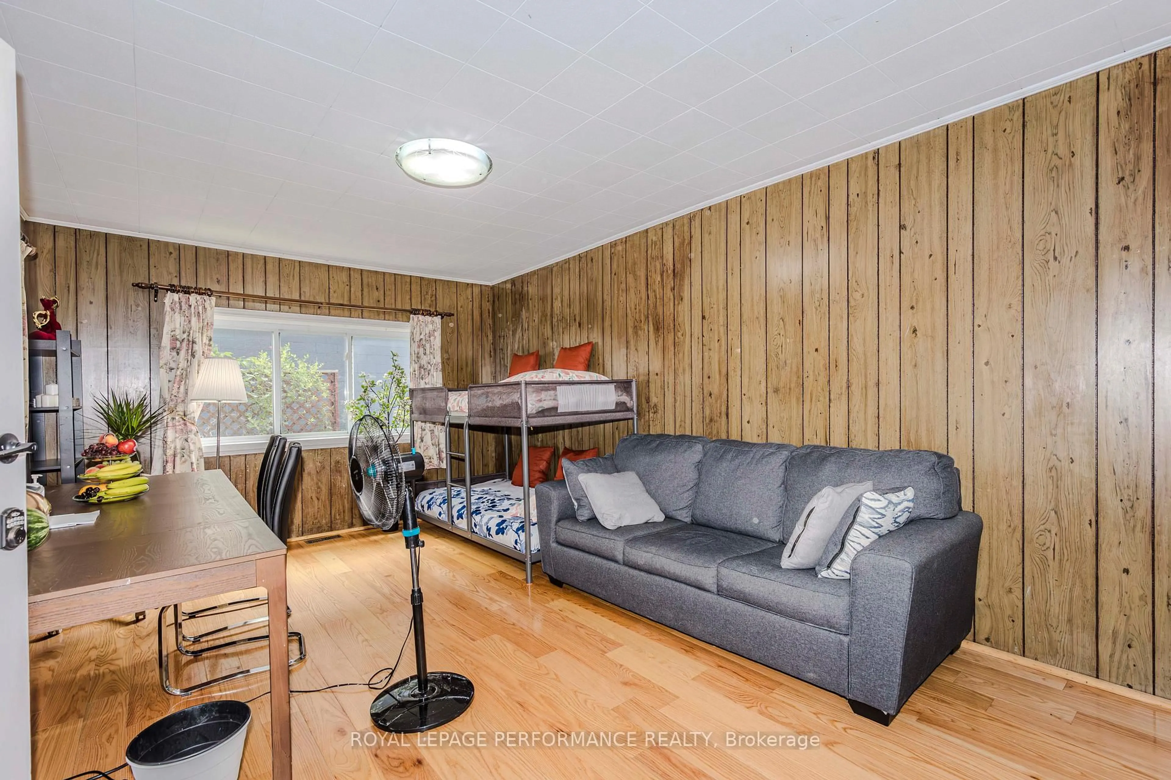 Living room with furniture, wood/laminate floor for 98 Boyce Ave, Ottawa Ontario K2B 6J2