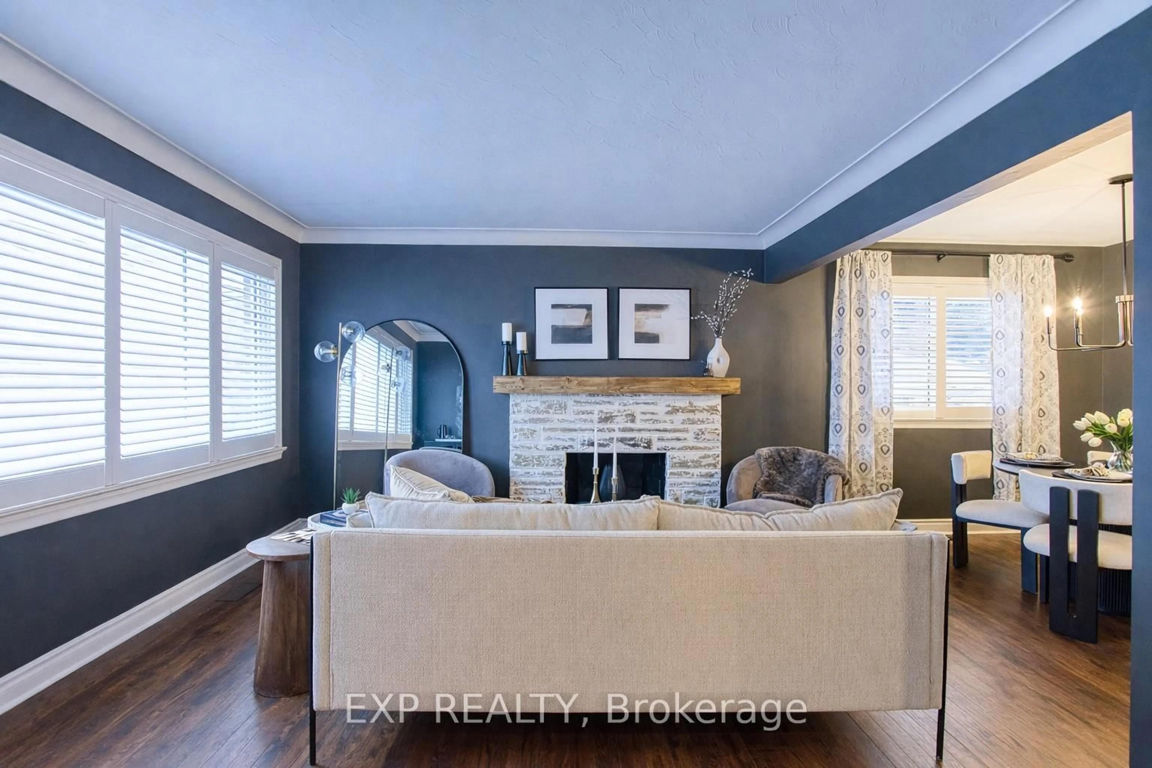 Living room with furniture, wood/laminate floor for 111 Leitch Dr, Grimsby Ontario L3M 2T9