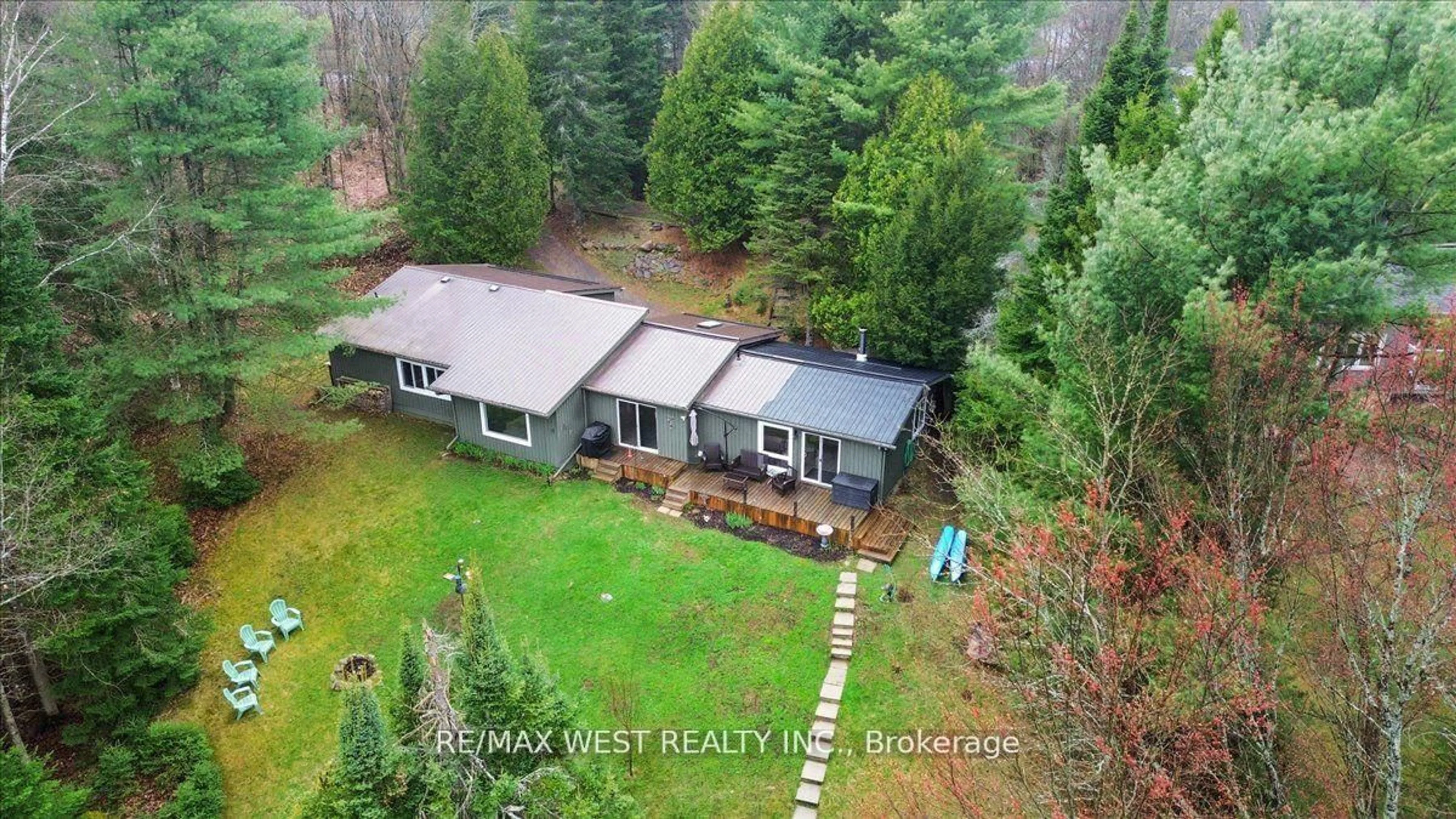 A pic from outside/outdoor area/front of a property/back of a property/a pic from drone, forest/trees view for 1017 Rays Lane, Minden Hills Ontario K0M 2K0