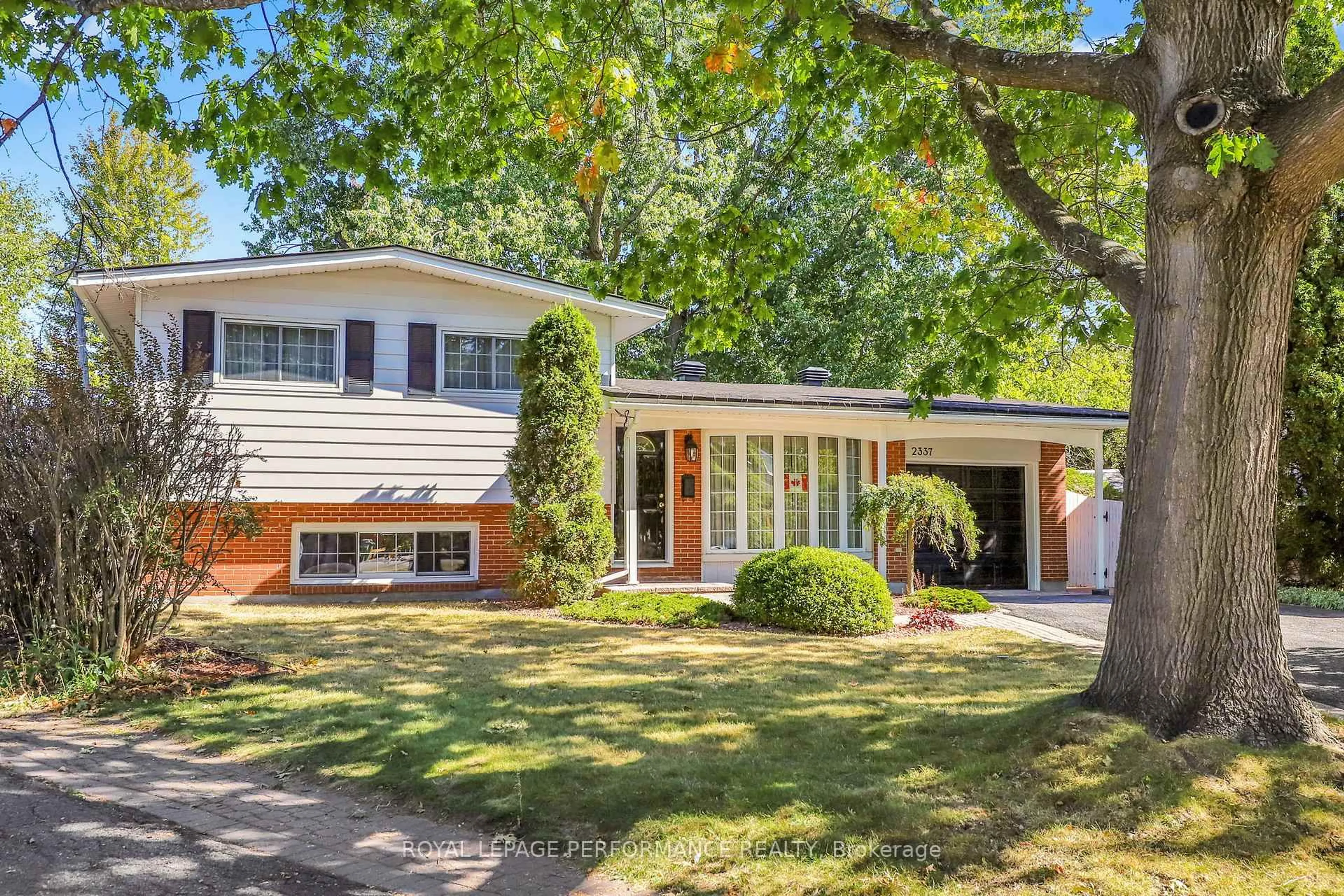 Home with brick exterior material, street for 2337 Samuel Dr, Ottawa Ontario K1G 3C3