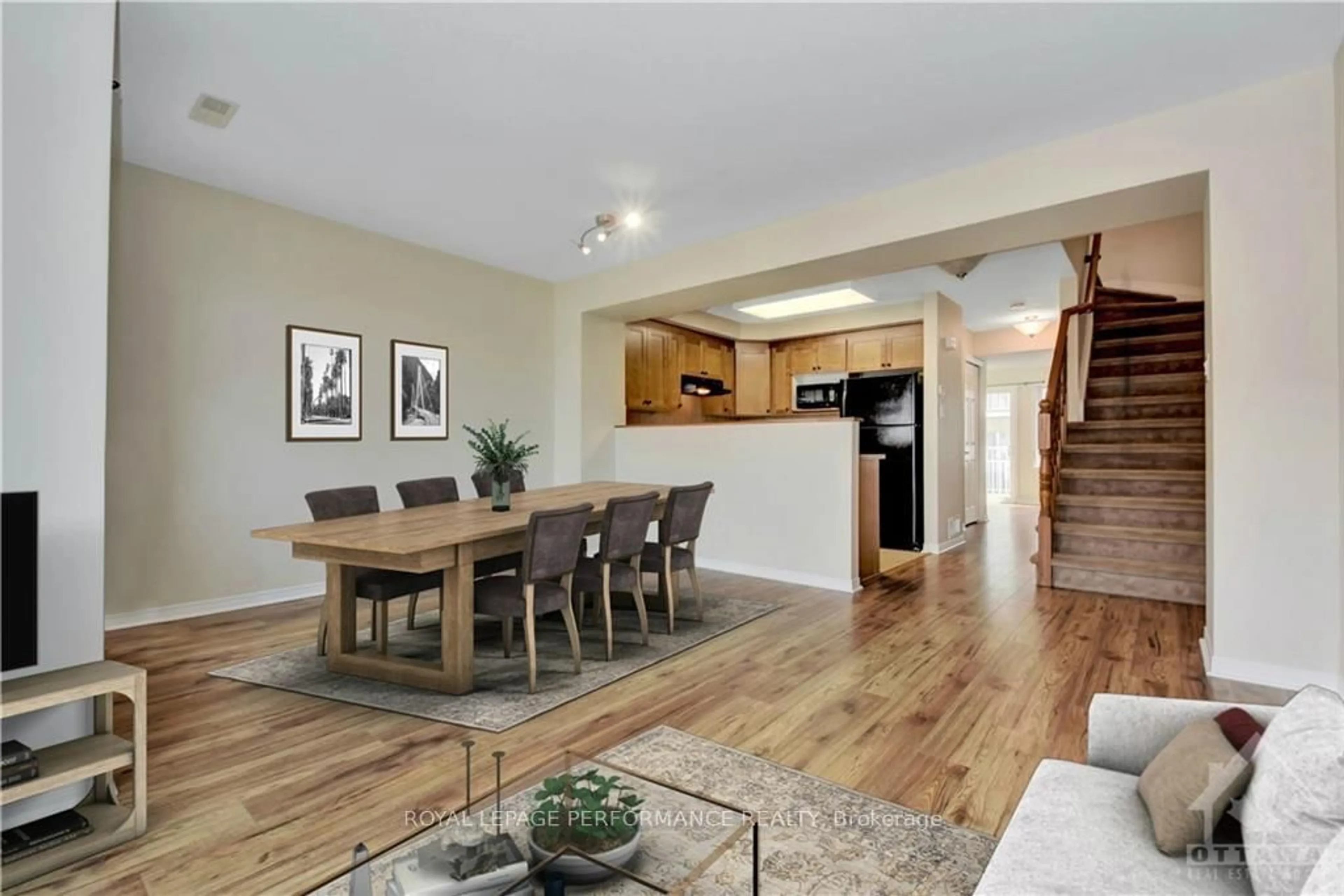 Open concept kitchen, wood/laminate floor for 125 Windswept Private, Ottawa Ontario K1V 0Z4