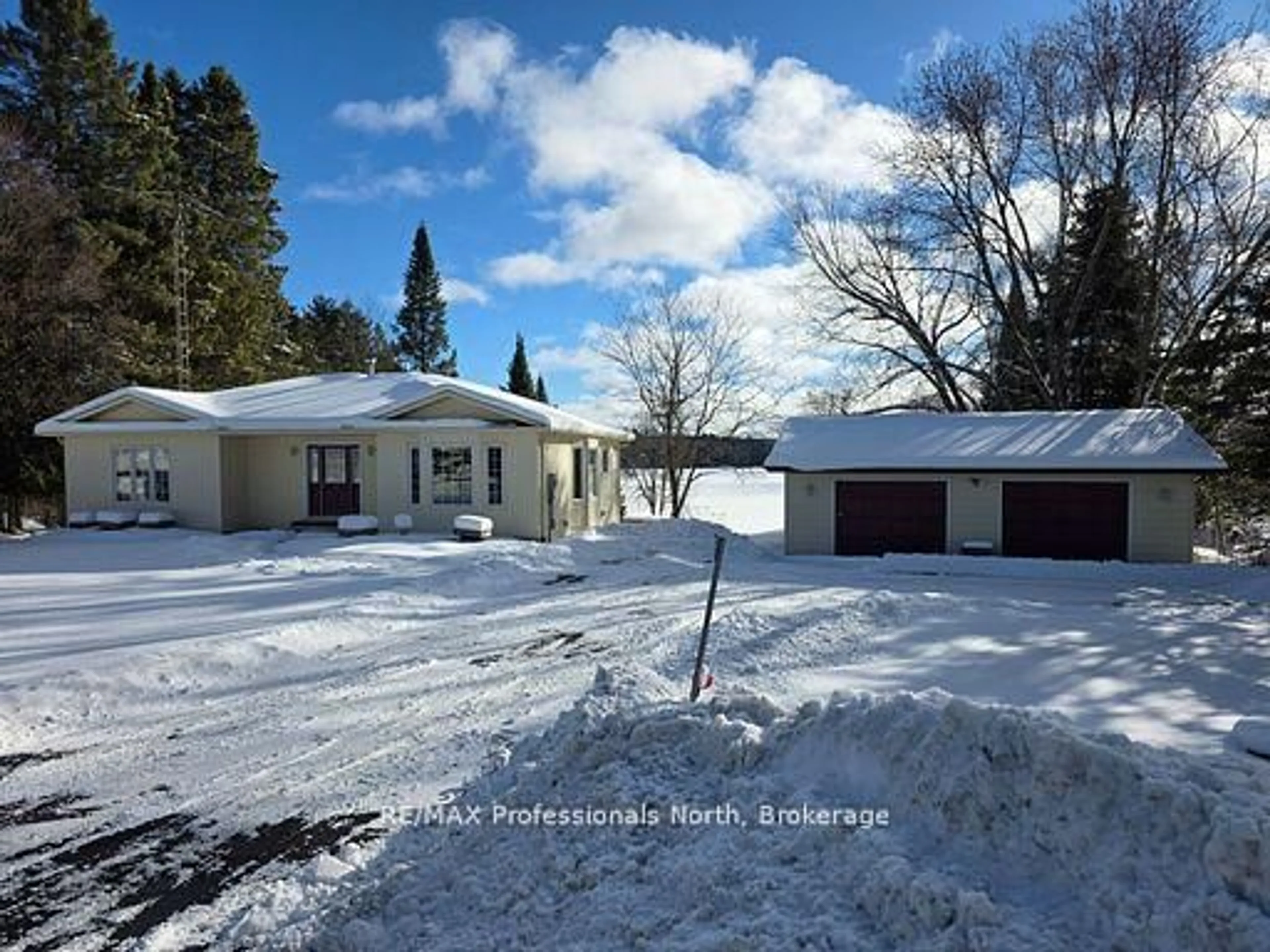 A pic from outside/outdoor area/front of a property/back of a property/a pic from drone, street for 4696 County Road 21, Dysart et al Ontario K0M 1S0