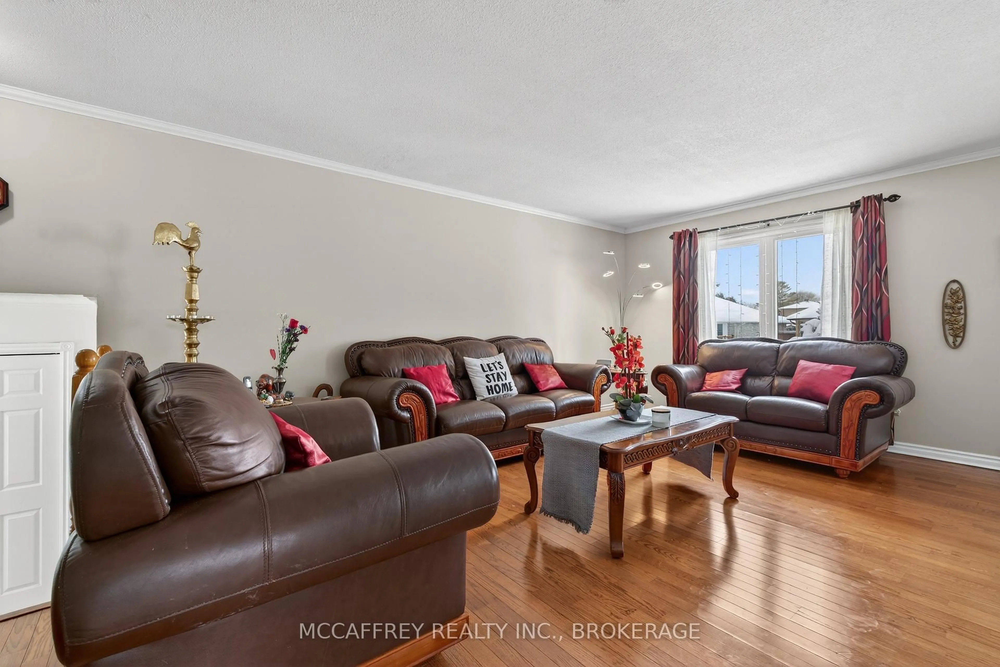 Living room with furniture, wood/laminate floor for 1311 CUTHBERTSON Ave, Brockville Ontario K6V 6Y2