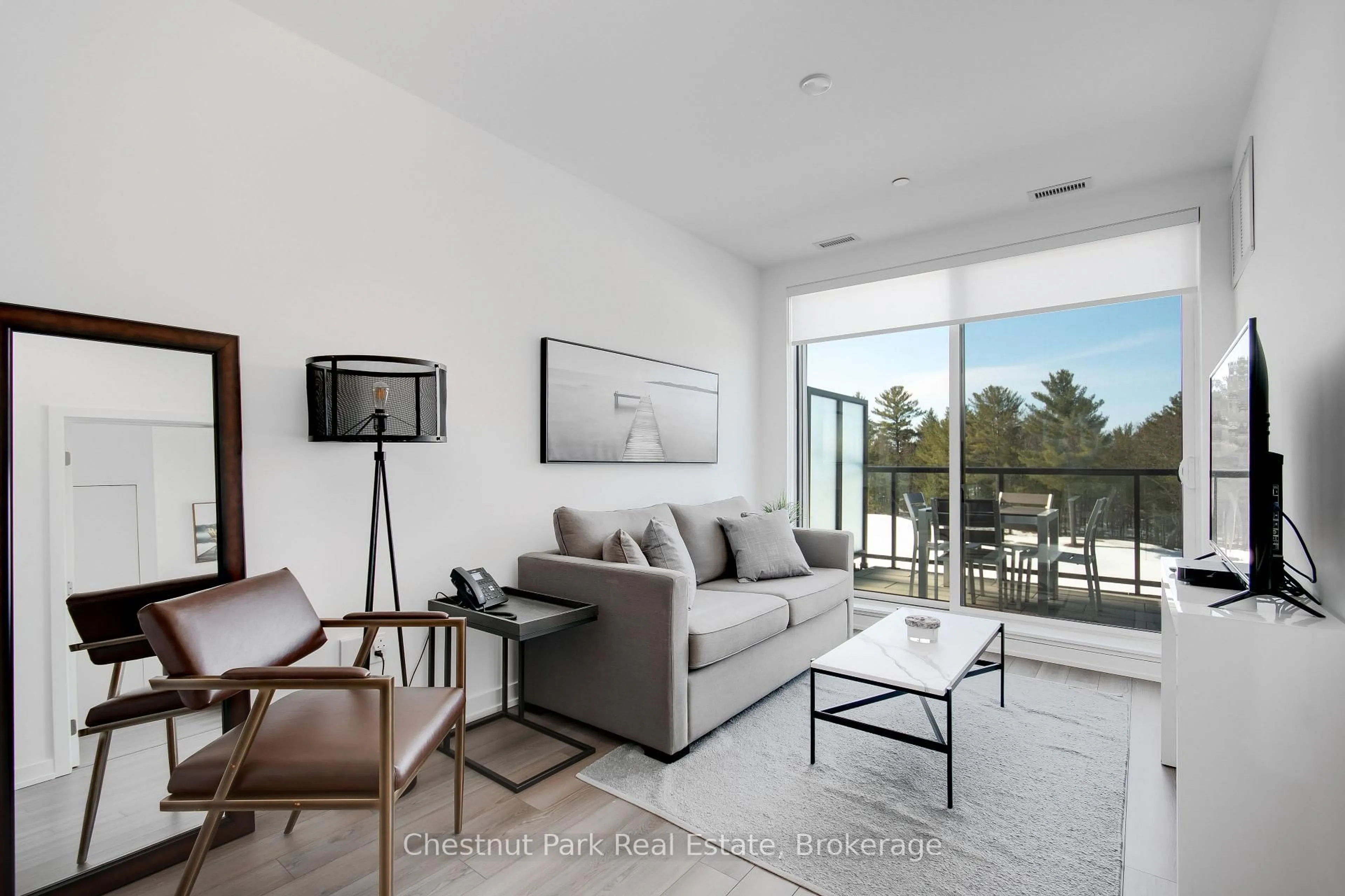 Living room with furniture, unknown for 120 Carrick Tr #404, Gravenhurst Ontario P1P 0A2