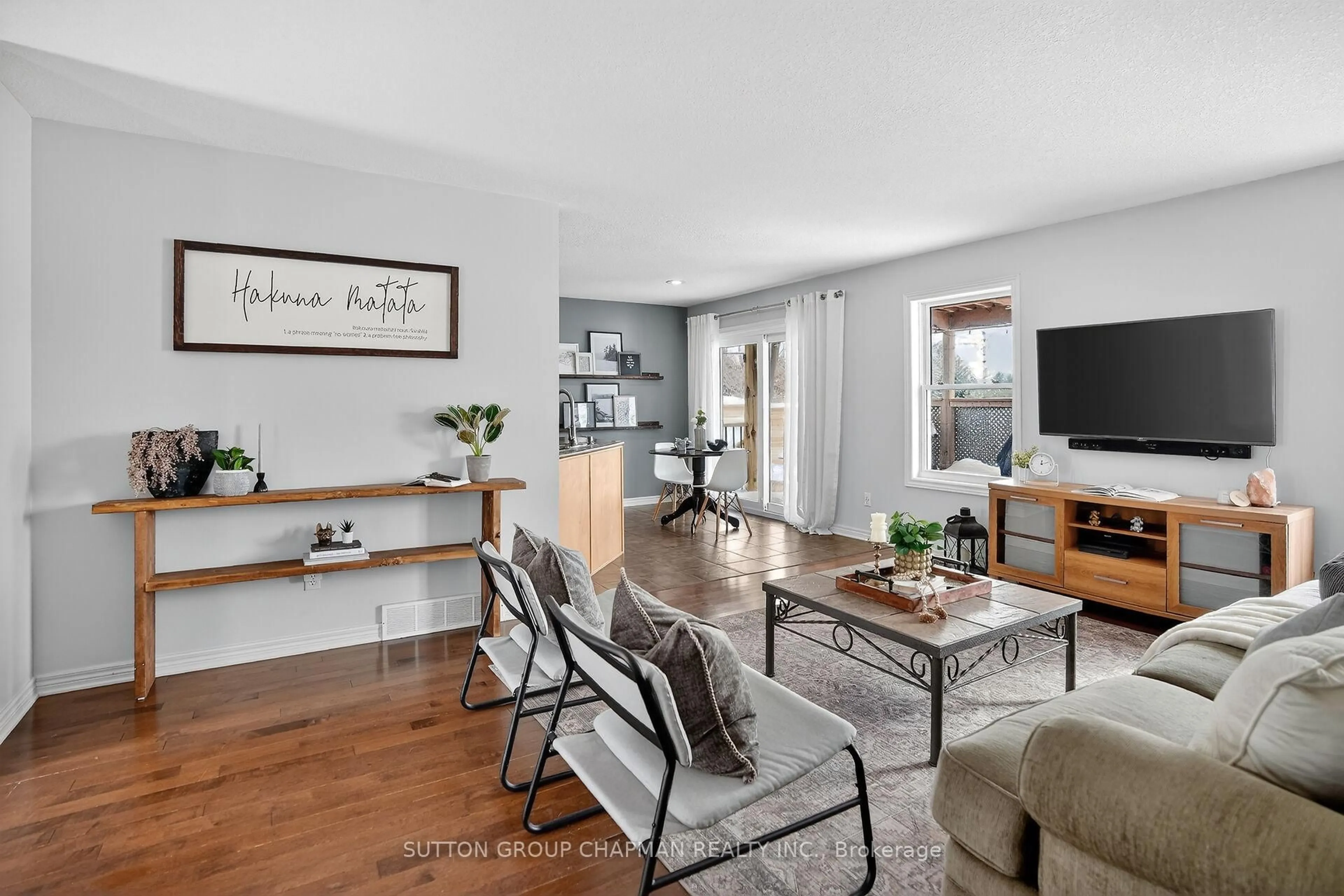 Living room with furniture, wood/laminate floor for 519 Station St, Lucan Biddulph Ontario N0M 1V0