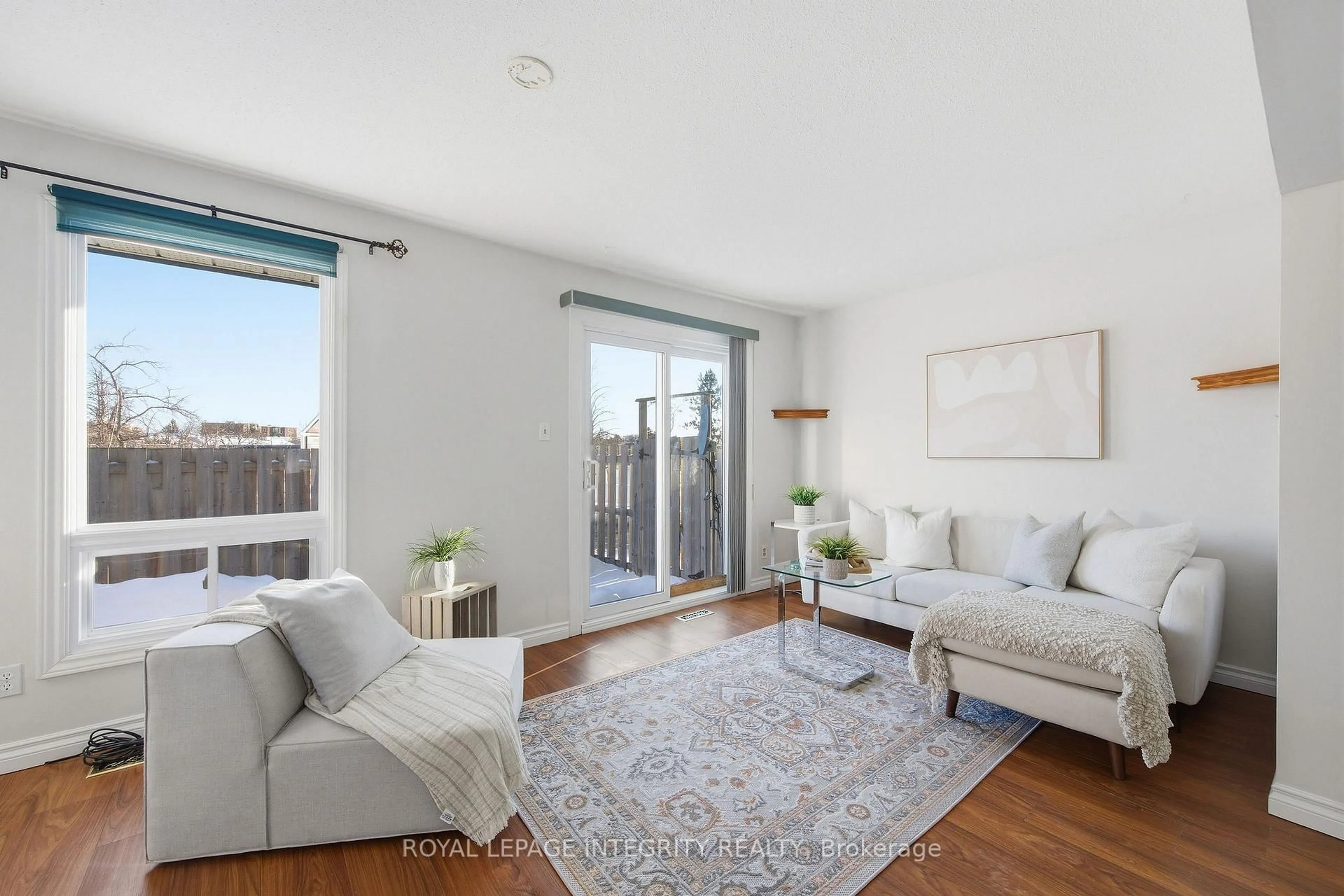 Living room with furniture, wood/laminate floor for 3301 Mccarthy Rd #8, Ottawa Ontario K1V 9X5