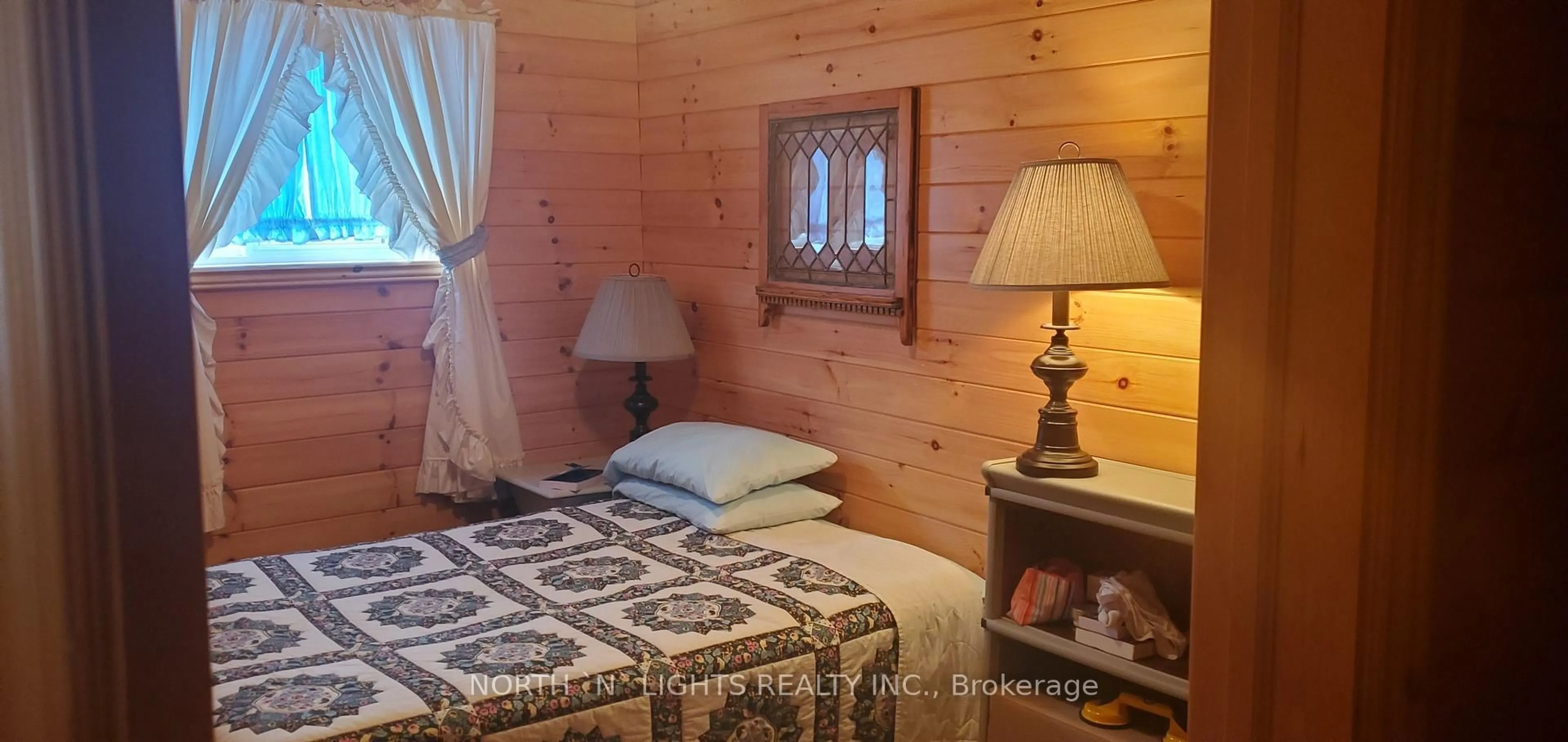 Bedroom with bed, wood/laminate floor for 64 BAISE Ave, Northern Bruce Peninsula Ontario N0H 2R0