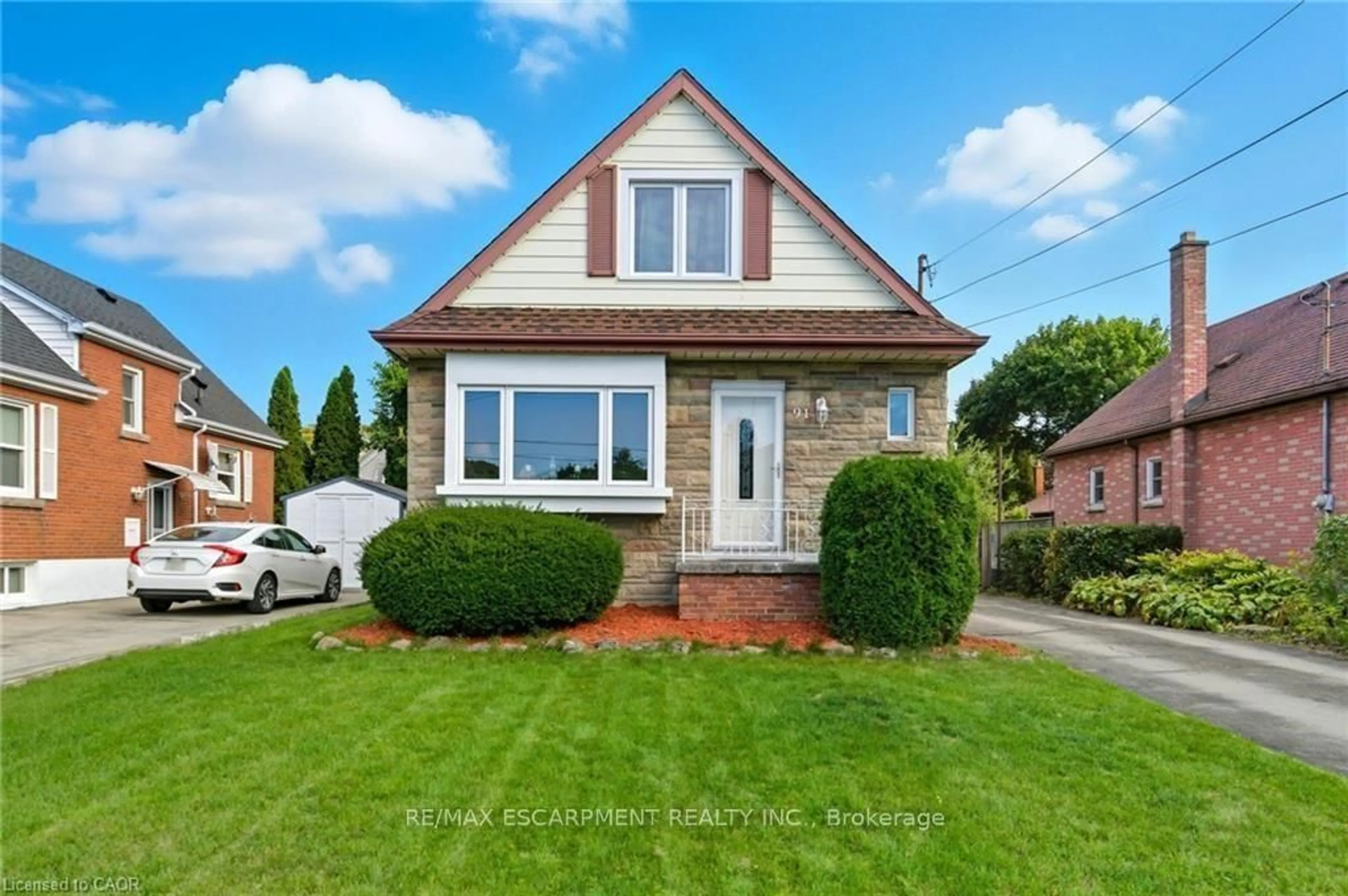 Home with brick exterior material, street for 91 East 42nd St, Hamilton Ontario L8T 3A2