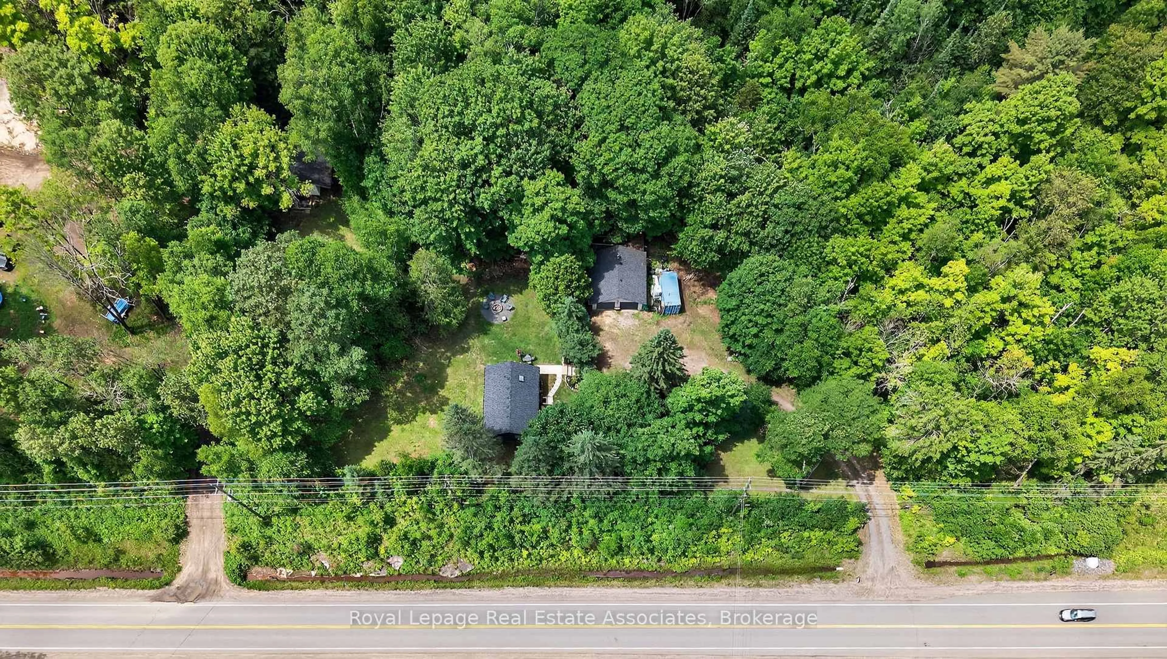 A pic from outside/outdoor area/front of a property/back of a property/a pic from drone, forest/trees view for 17377 35 Highway, Algonquin Highlands Ontario K0M 1S0