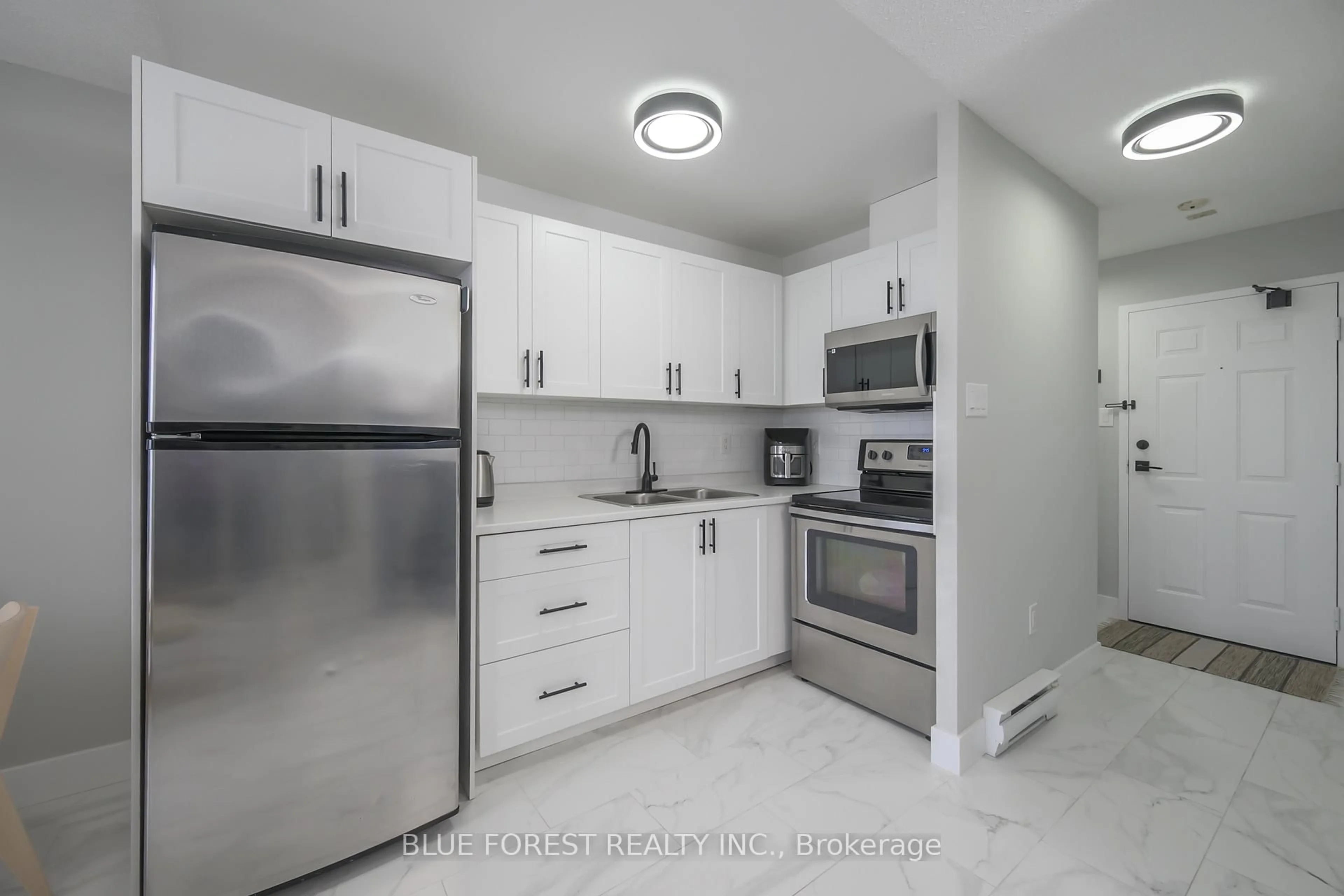 Standard kitchen, ceramic/tile floor for 76 Base Line Rd #1105, London South Ontario N6J 4X6