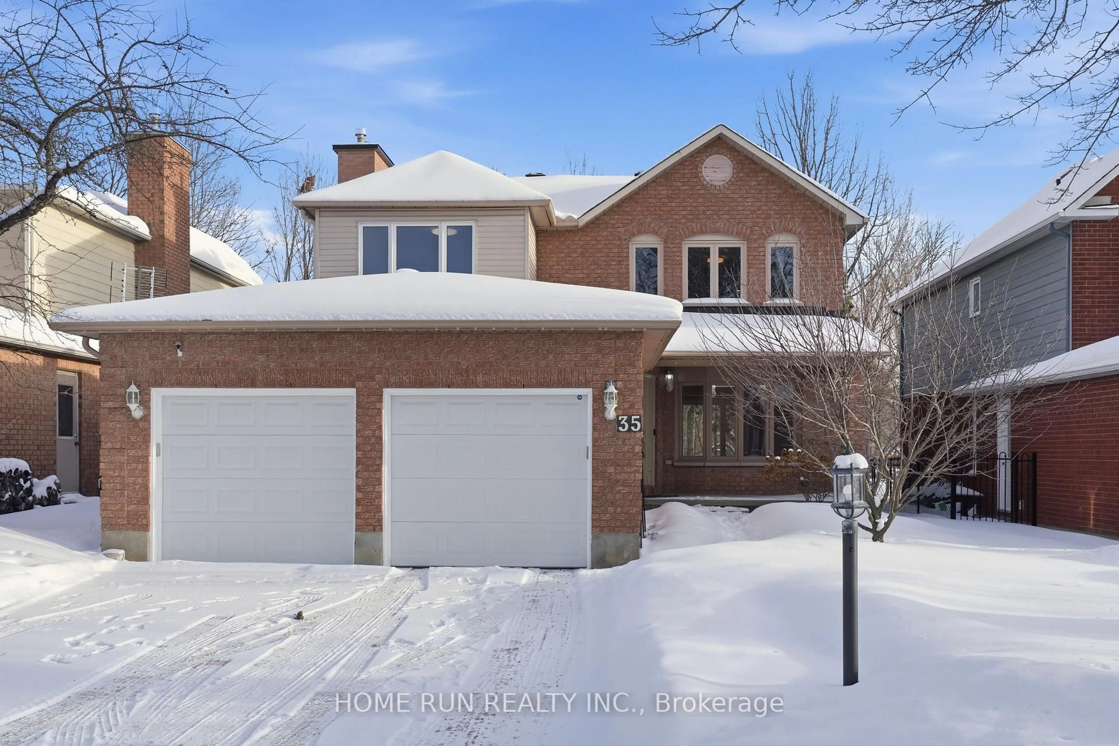 Home with brick exterior material, street for 35 Weslock Way, Ottawa Ontario K2K 2K3