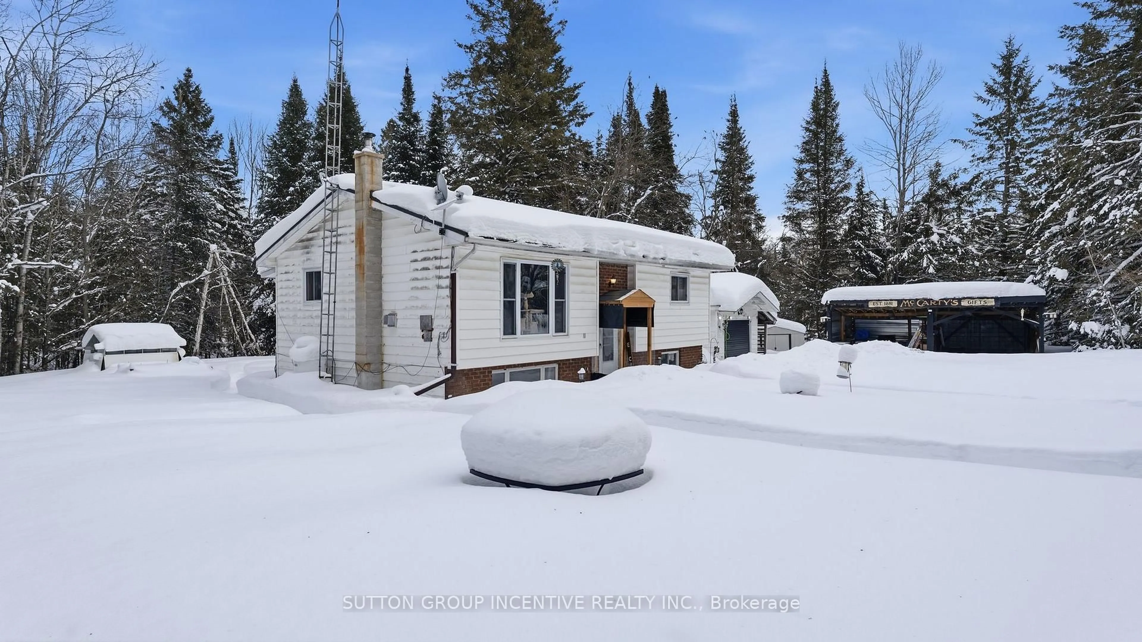 A pic from outside/outdoor area/front of a property/back of a property/a pic from drone, street for 1204 Bacon Rd, Minden Hills Ontario K0M 2A1