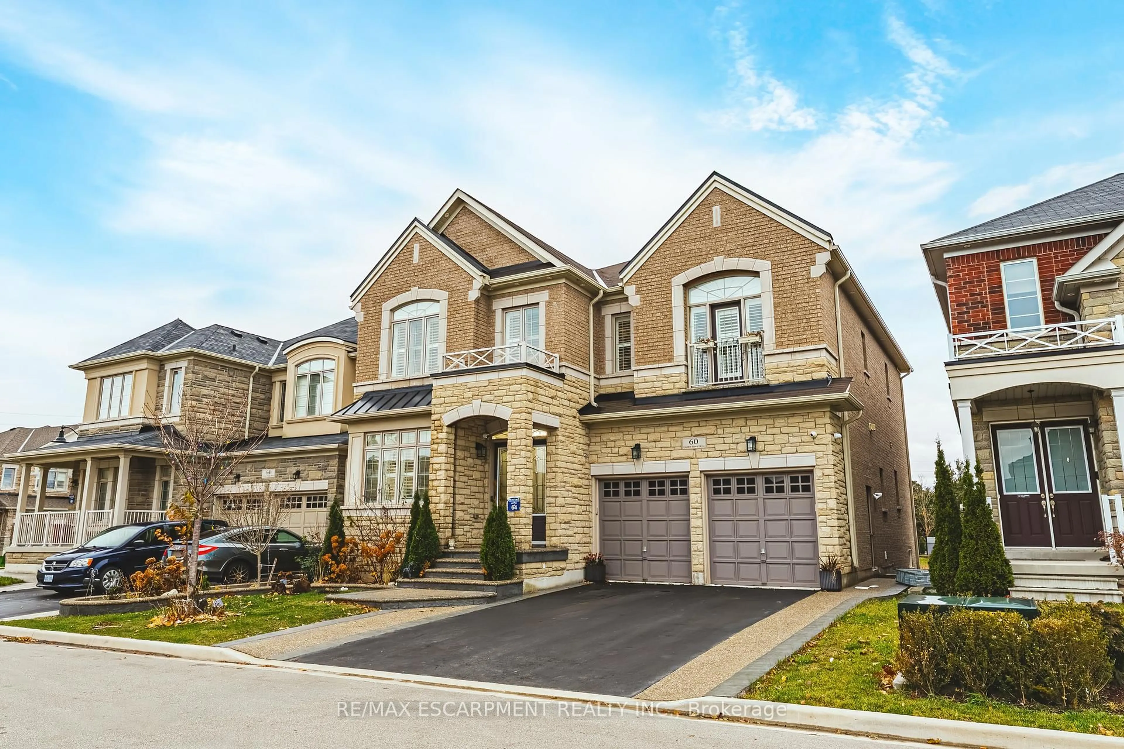 Home with brick exterior material, street for 60 Golden Hawk Dr, Hamilton Ontario L8B 1W9