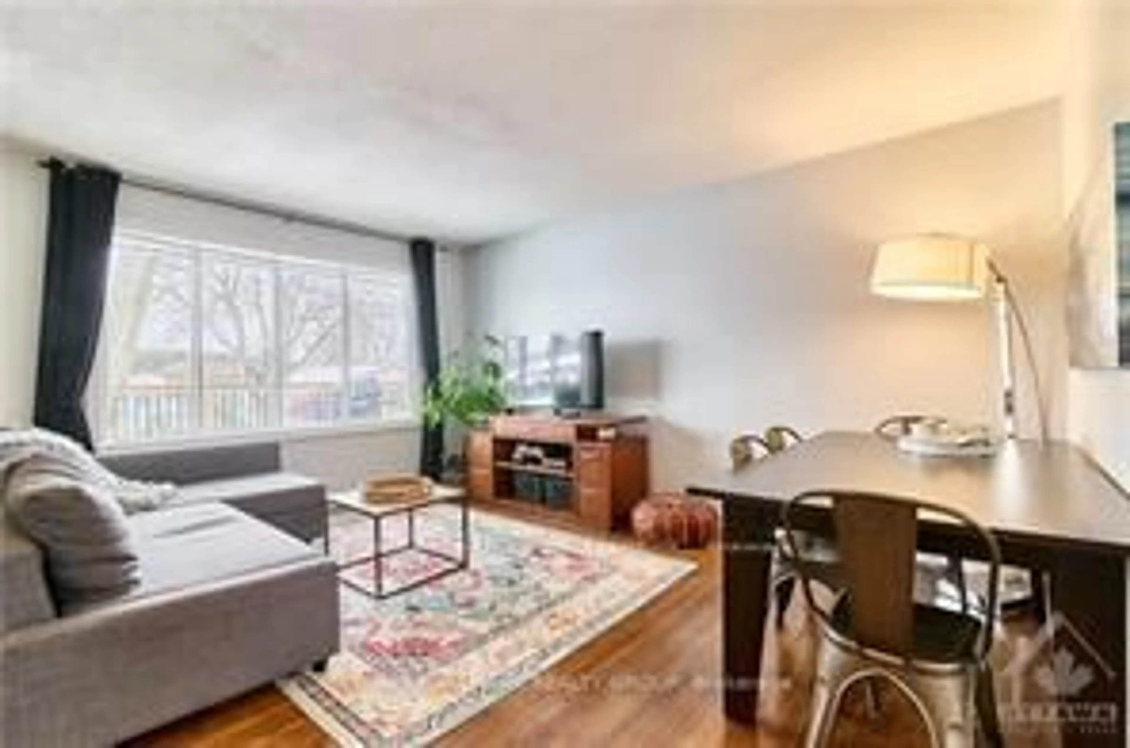 Living room with furniture, wood/laminate floor for 841 Balsam Dr, Ottawa Ontario K1E 1B8