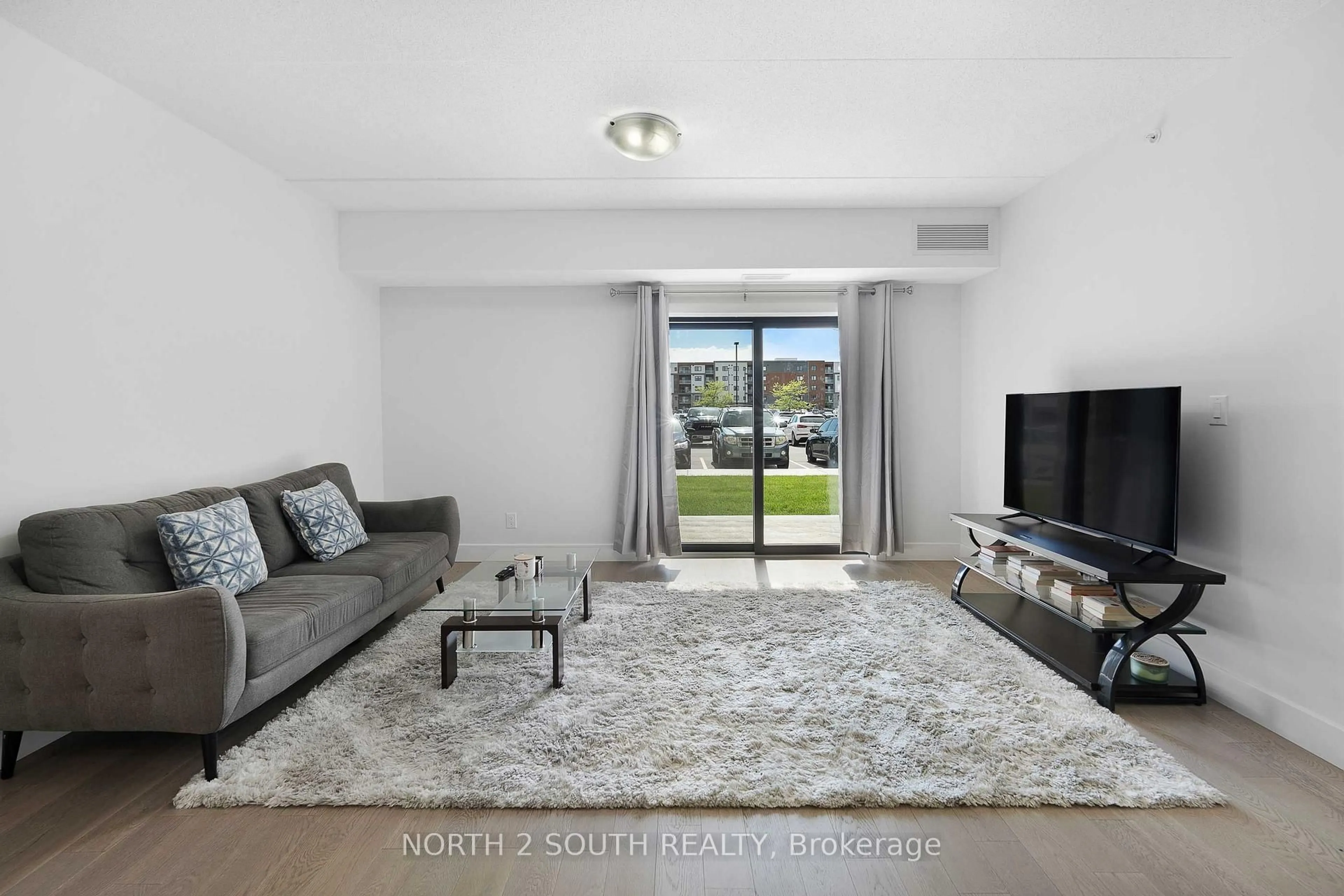 Living room with furniture, unknown for 2550 Sandwich West Pkwy #102, LaSalle Ontario N9H 0N4