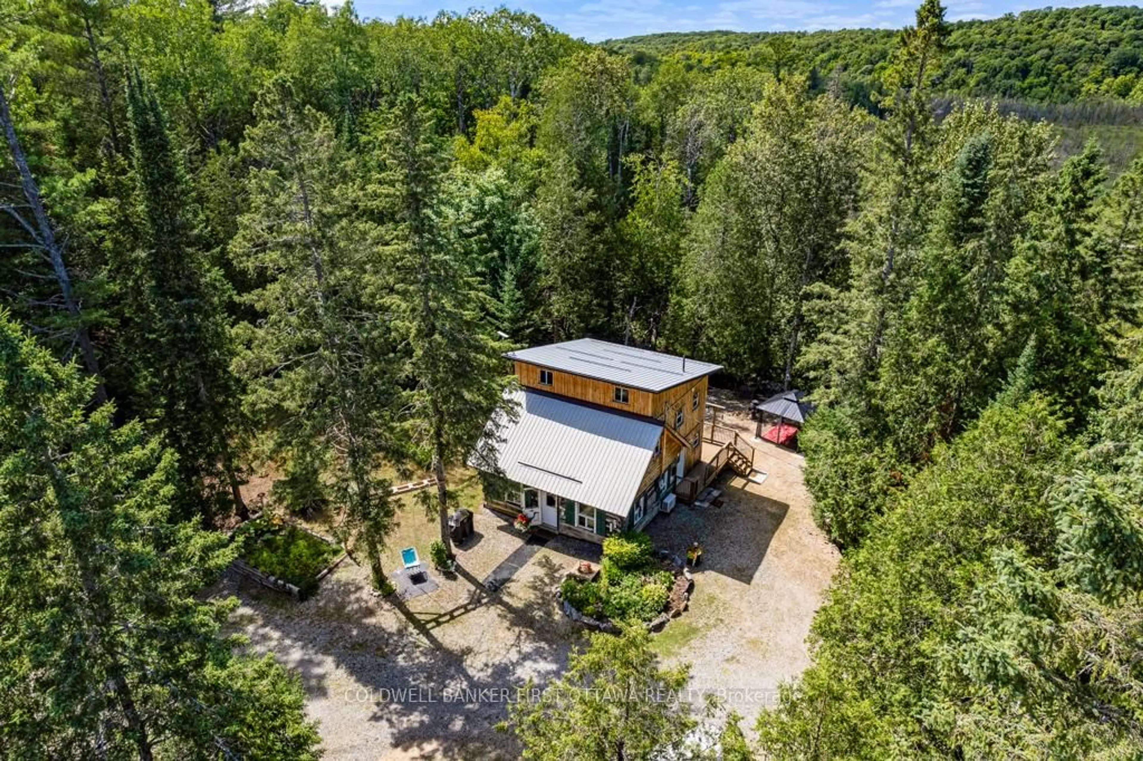 A pic from outside/outdoor area/front of a property/back of a property/a pic from drone, forest/trees view for 1169 Mosque Lake Rd, Ompah Ontario K0H 2J0
