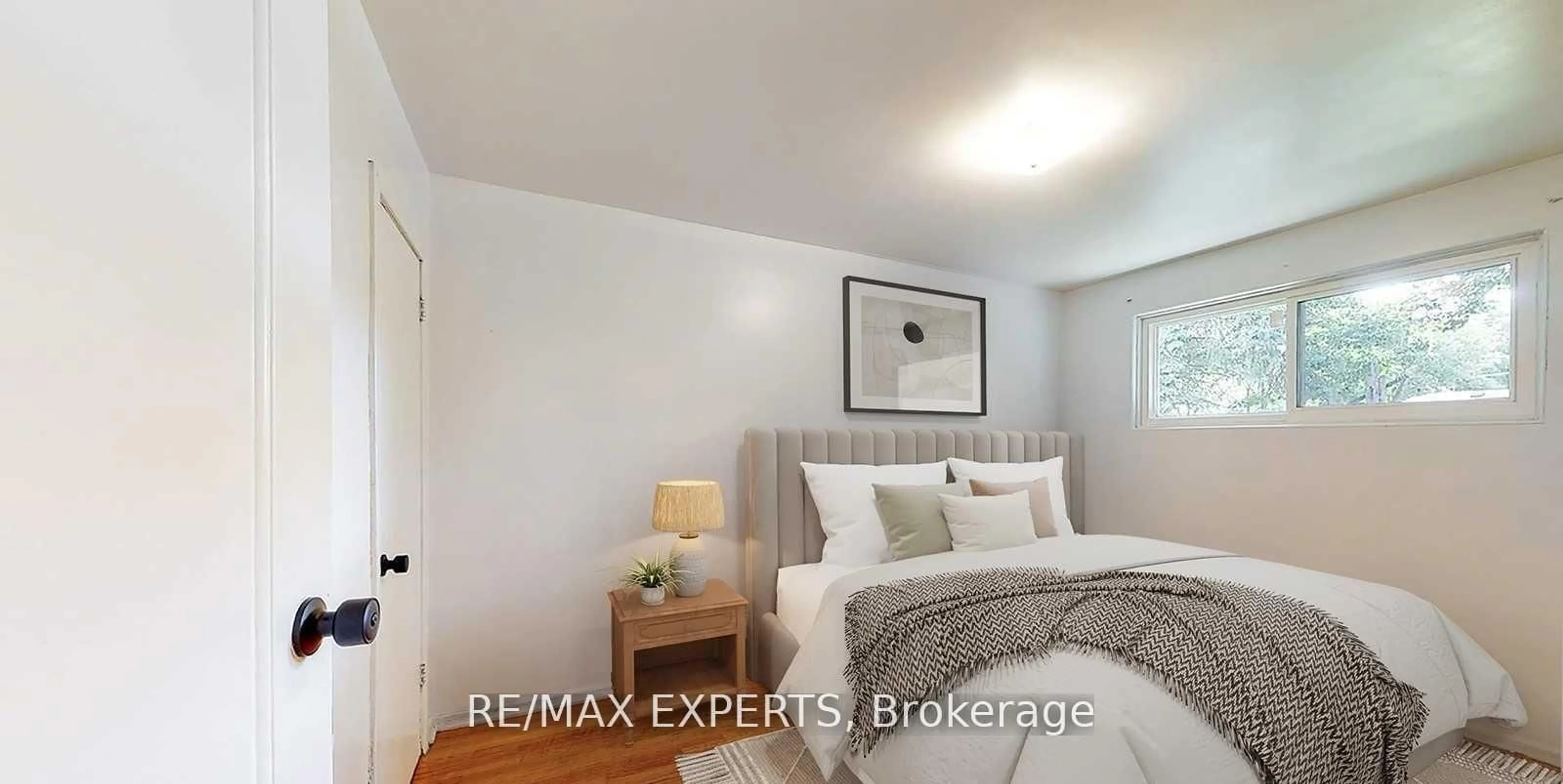 Bedroom with bed, wood/laminate floor for 153 Ward Ave, Hamilton Ontario L8S 2G1