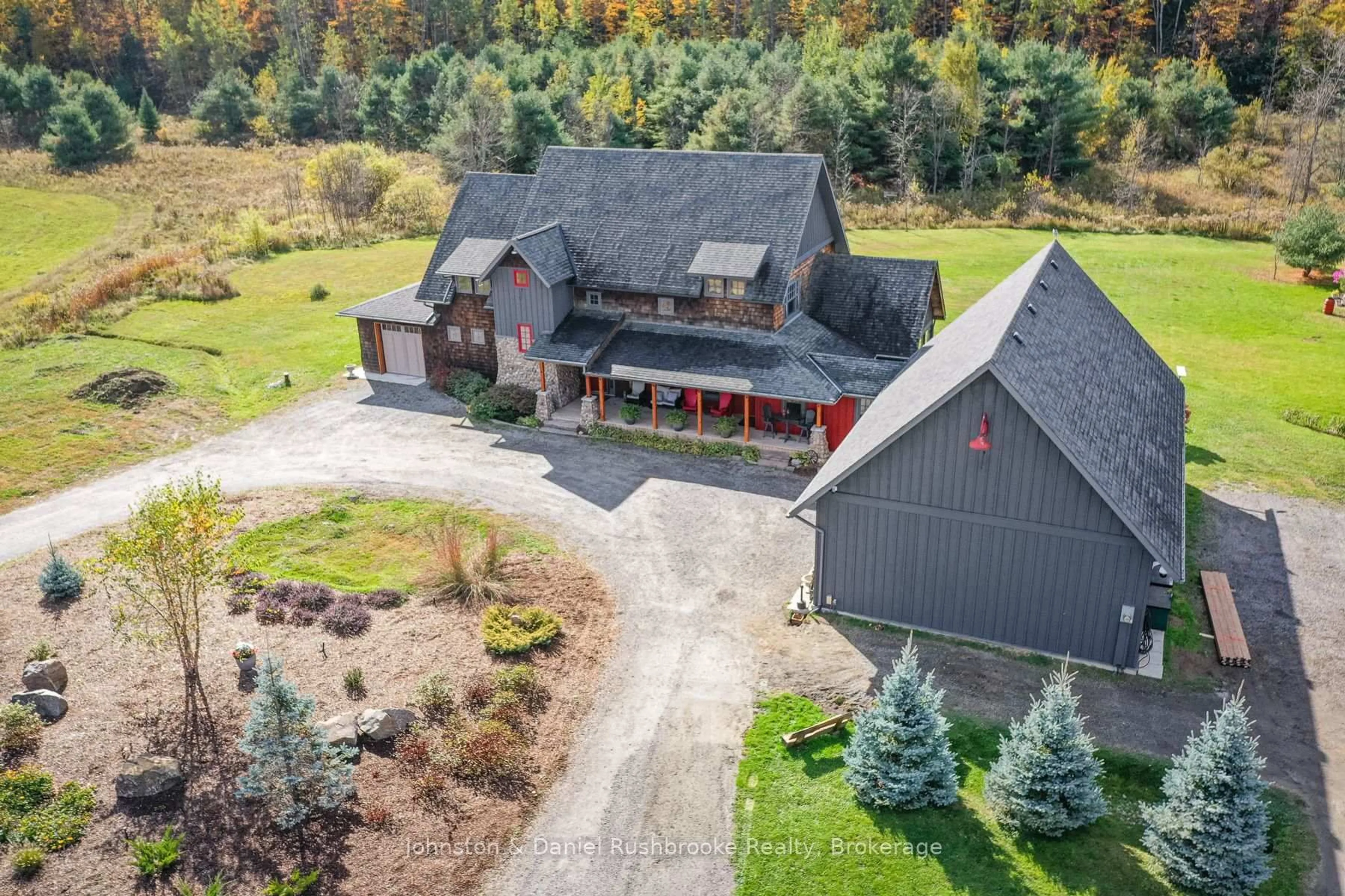 A pic from outside/outdoor area/front of a property/back of a property/a pic from drone, mountain view for 1422 Muskoka Rd 118 Rd, Bracebridge Ontario P1L 1W8