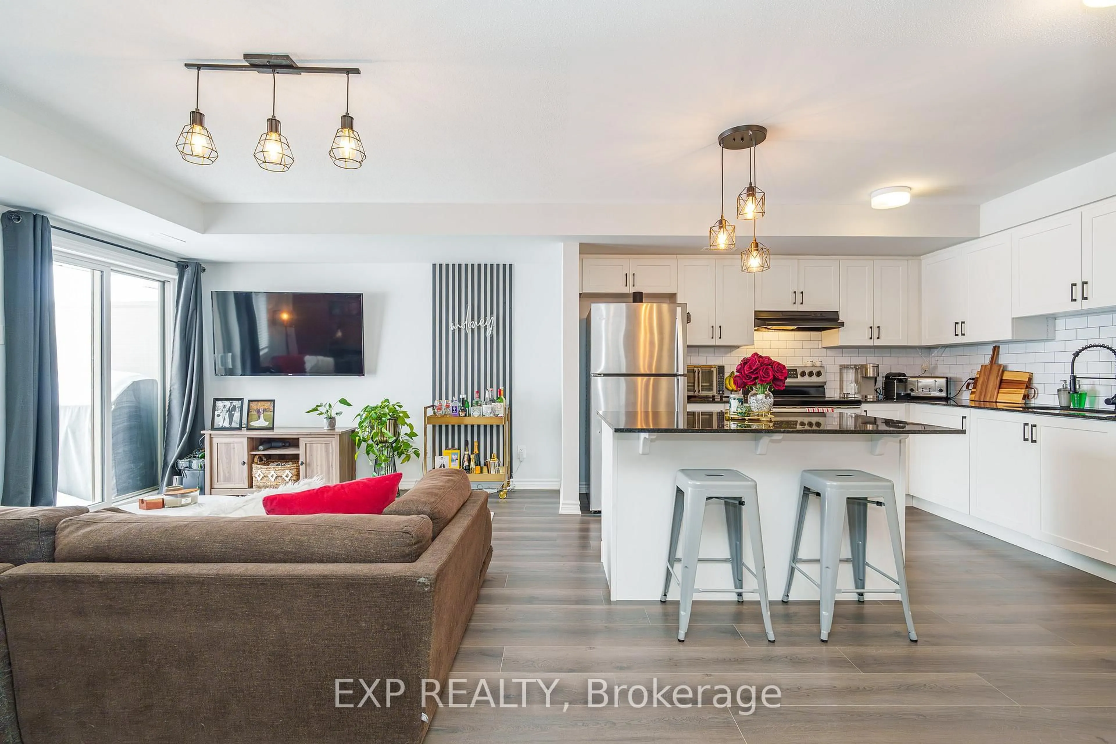 Open concept kitchen, wood/laminate floor for 852 Atlas Terr, Ottawa Ontario K2V 0S3