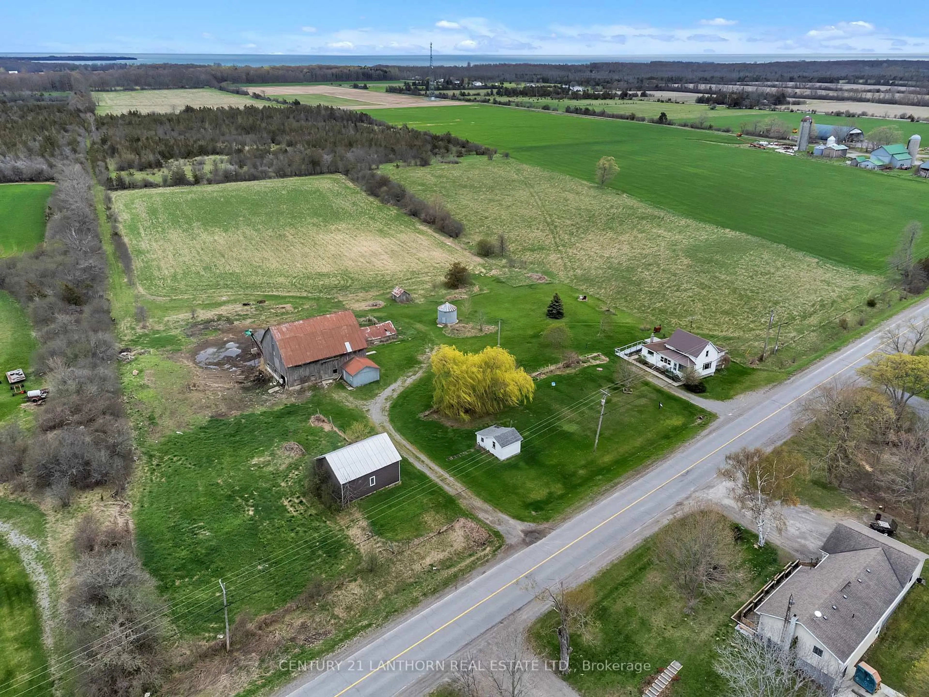 A pic from outside/outdoor area/front of a property/back of a property/a pic from drone, street for 1205 County Road 18 Rd, Prince Edward County Ontario K0K 1P0