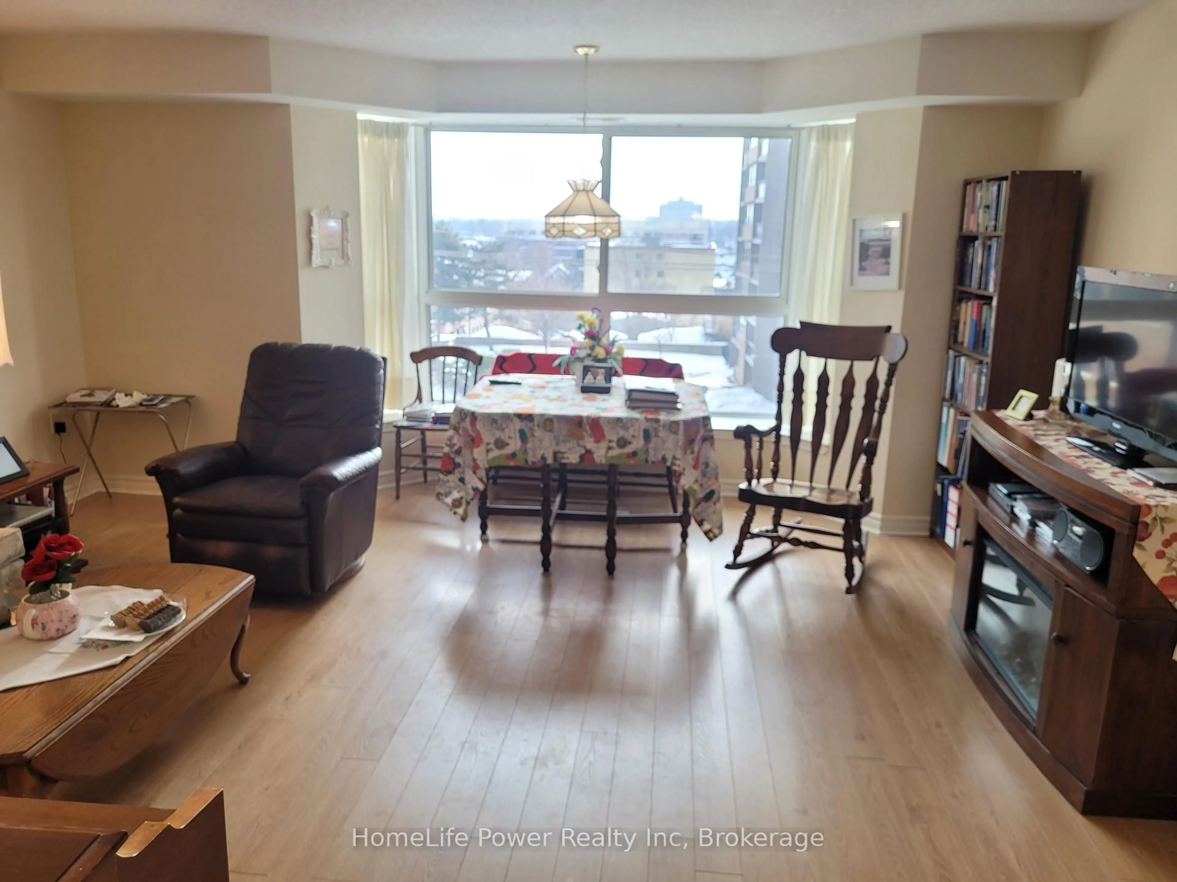Living room with furniture, wood/laminate floor for 20 ST GEORGE St #311, Kitchener Ontario N2G 2S7