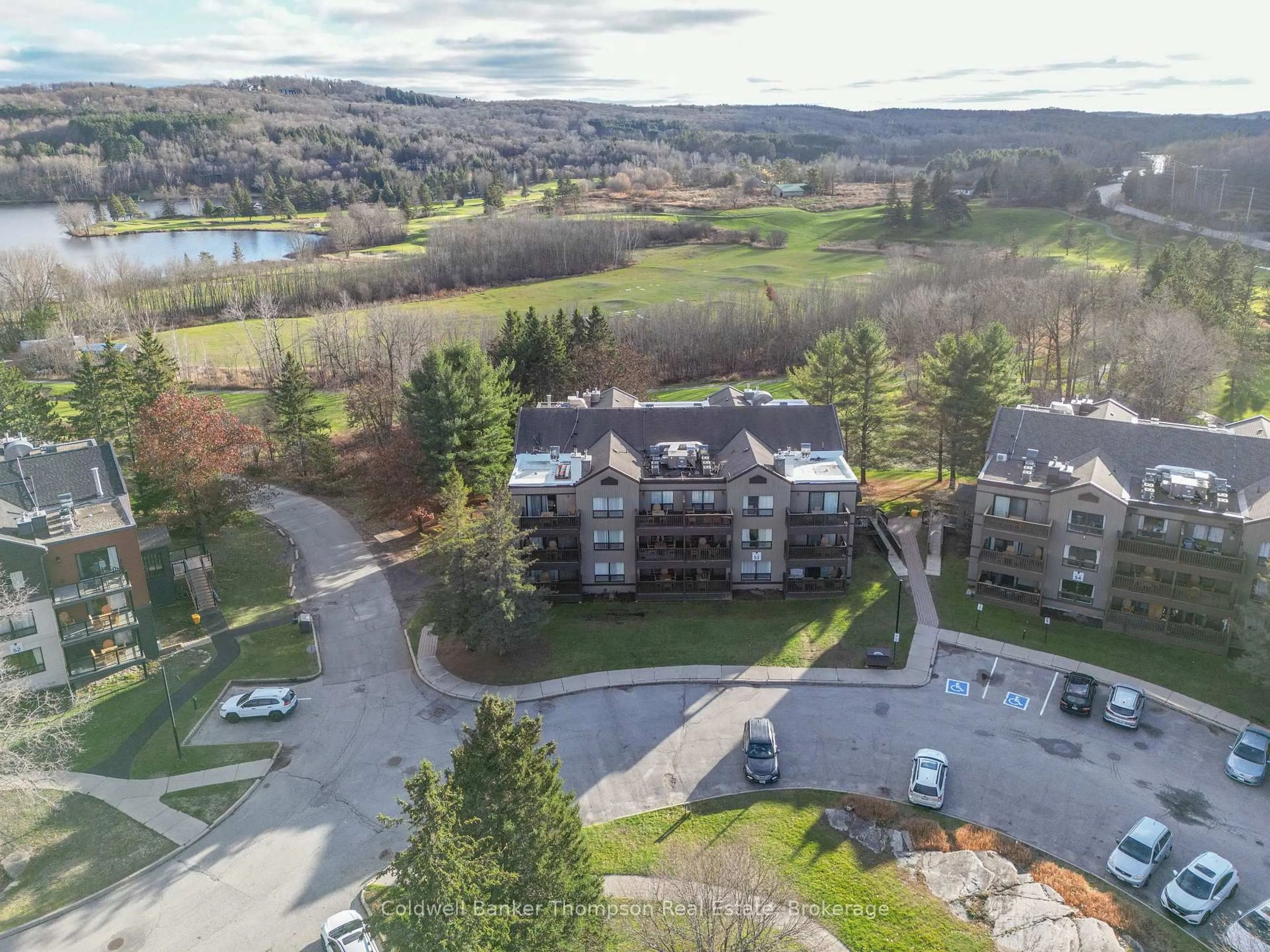 A pic from outside/outdoor area/front of a property/back of a property/a pic from drone, water/lake/river/ocean view for 1235 DEERHURST Dr #53-201, Huntsville Ontario P1H 2E8