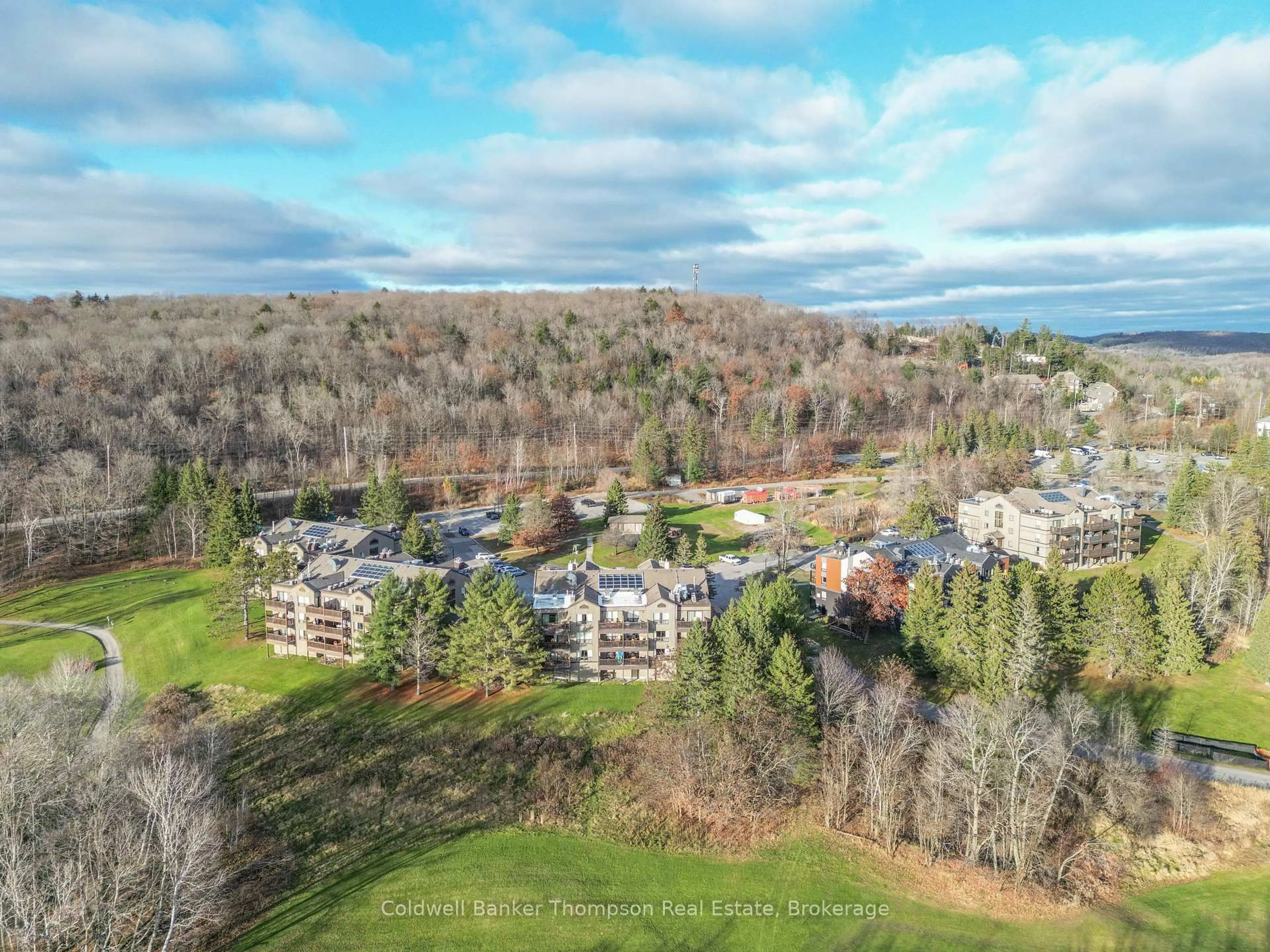 A pic from outside/outdoor area/front of a property/back of a property/a pic from drone, mountain view for 1235 DEERHURST Dr #53-201, Huntsville Ontario P1H 2E8