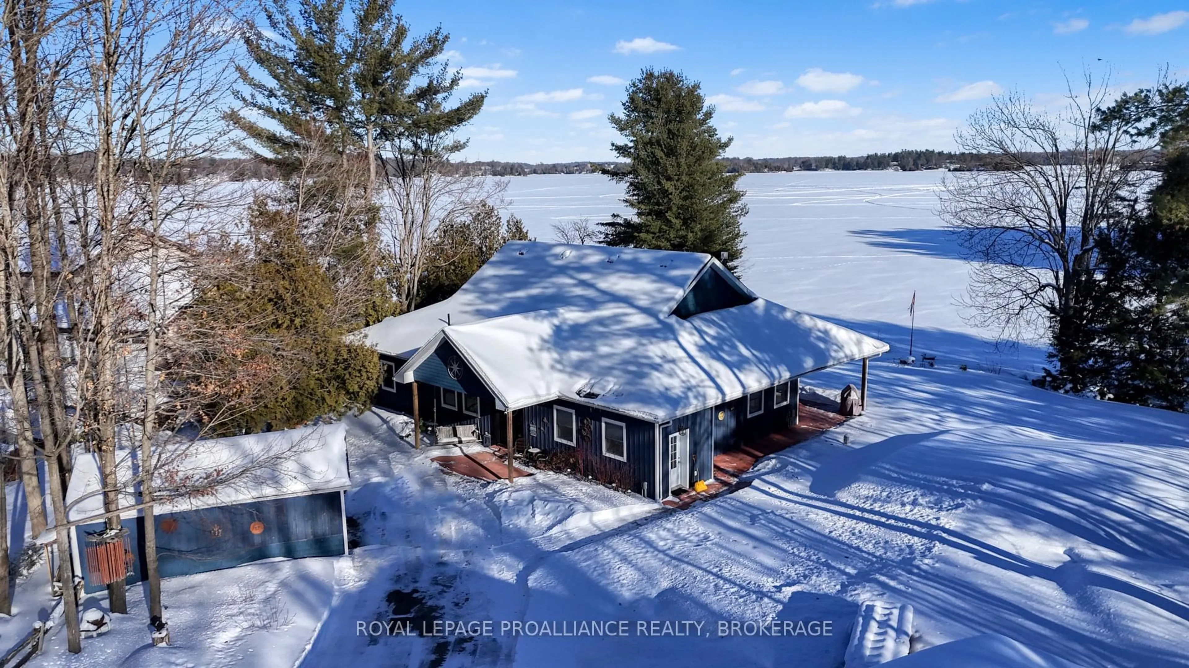 A pic from outside/outdoor area/front of a property/back of a property/a pic from drone, water/lake/river/ocean view for 4670 Lakewood Lane, Battersea Ontario K0H 1H0