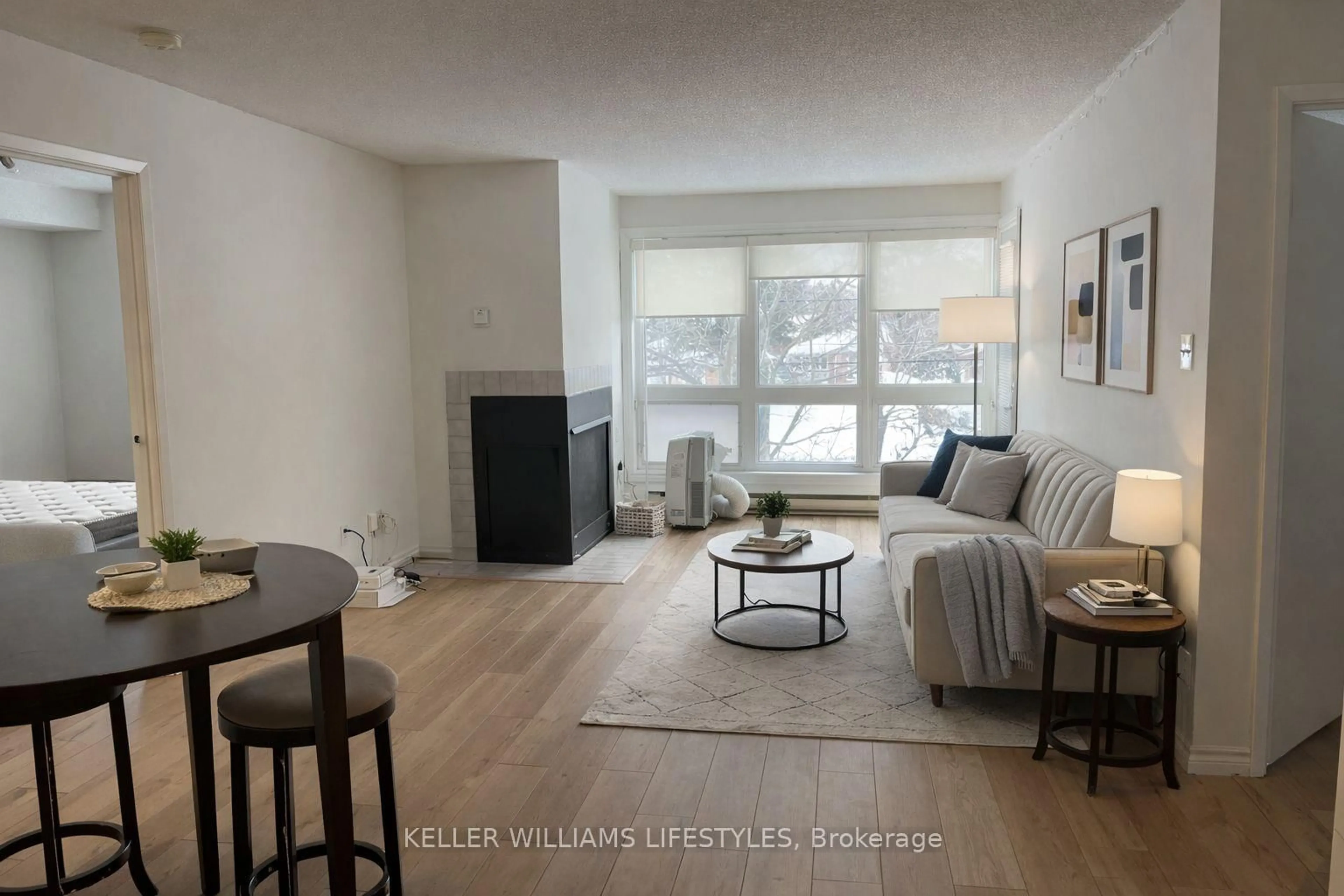 Living room with furniture, wood/laminate floor for 15 Jacksway Cres #320, London North Ontario N5X 3T5