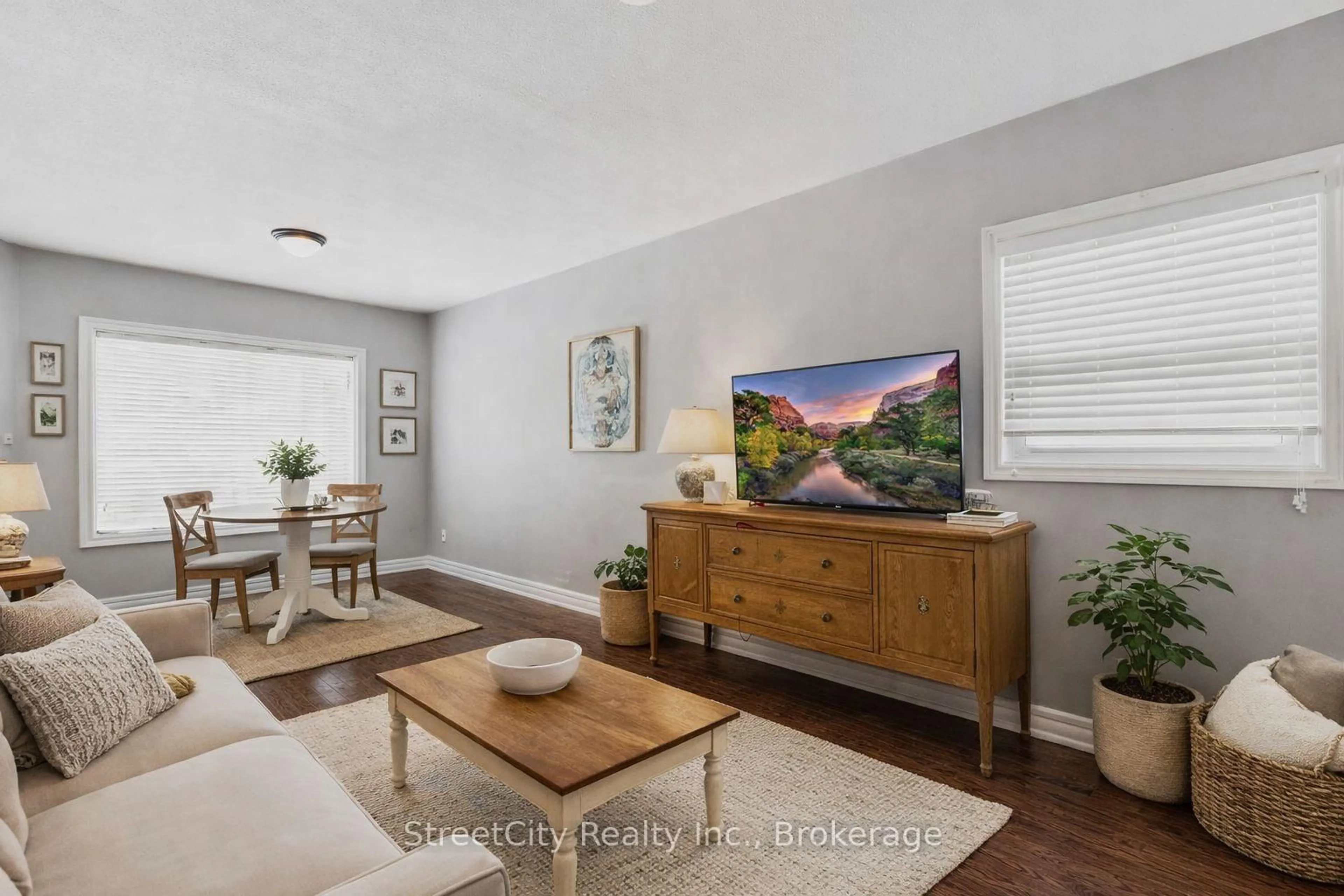 Living room with furniture, wood/laminate floor for 56 Stratford St, Stratford Ontario N5A 2H6