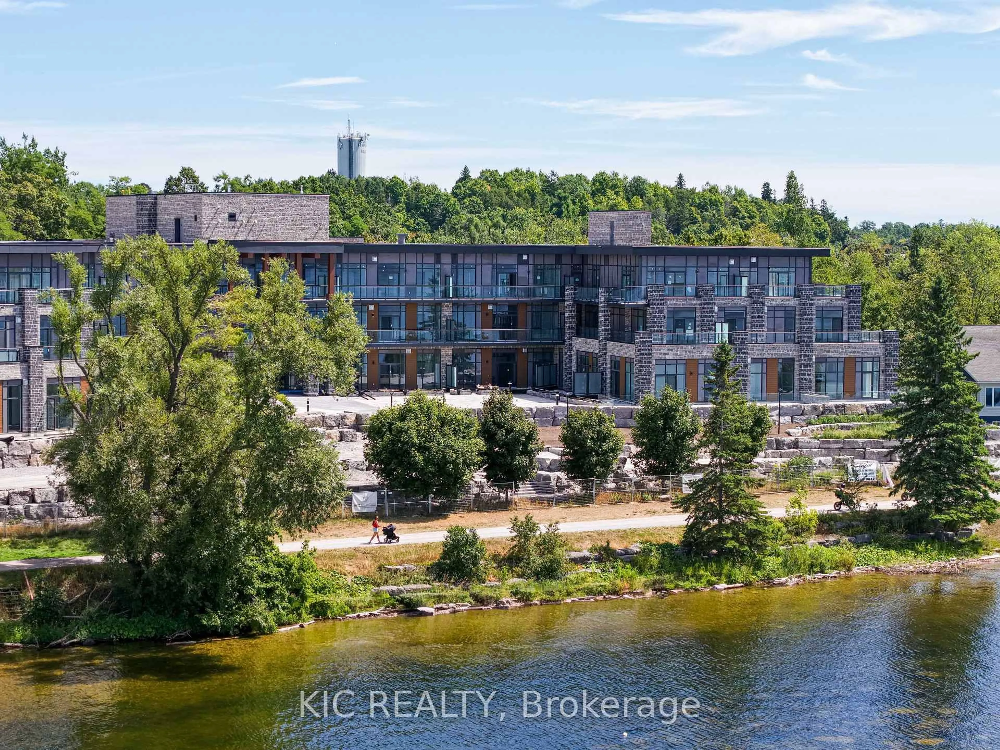 A pic from outside/outdoor area/front of a property/back of a property/a pic from drone, water/lake/river/ocean view for 99 Louisa St #210, Kawartha Lakes Ontario K0M 1N0