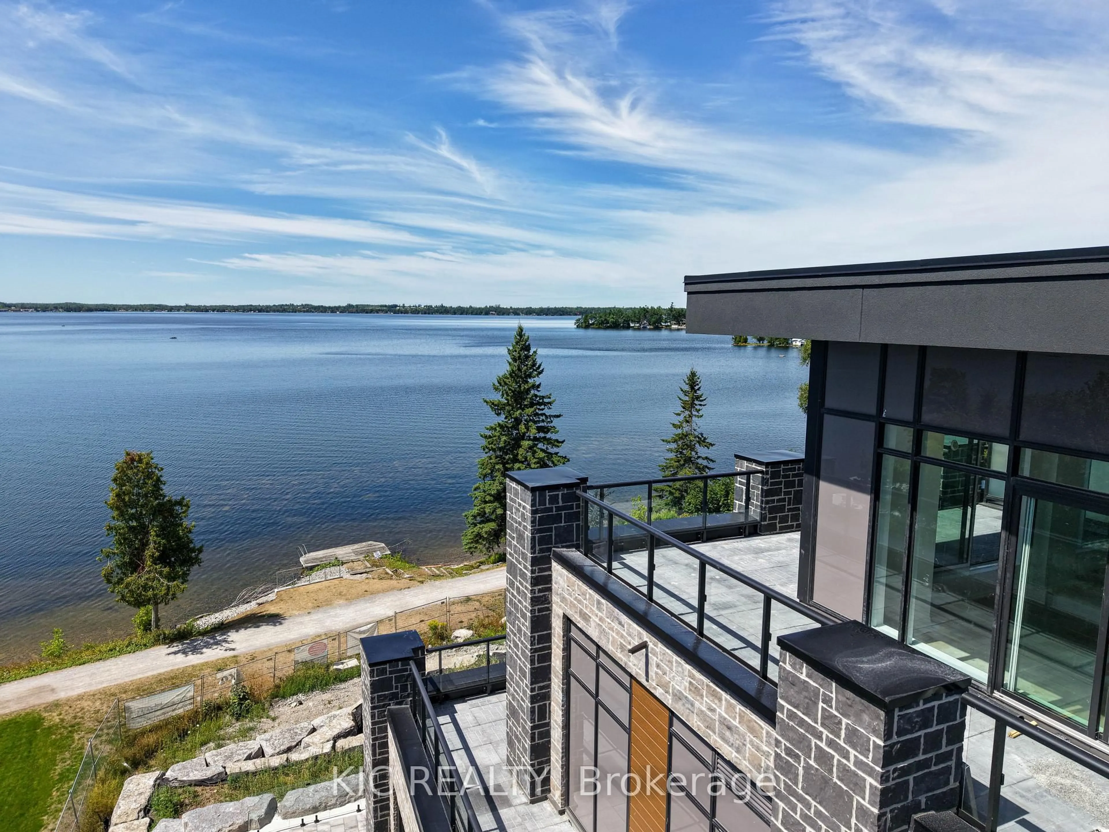 A pic from outside/outdoor area/front of a property/back of a property/a pic from drone, water/lake/river/ocean view for 99 Louisa St #210, Kawartha Lakes Ontario K0M 1N0