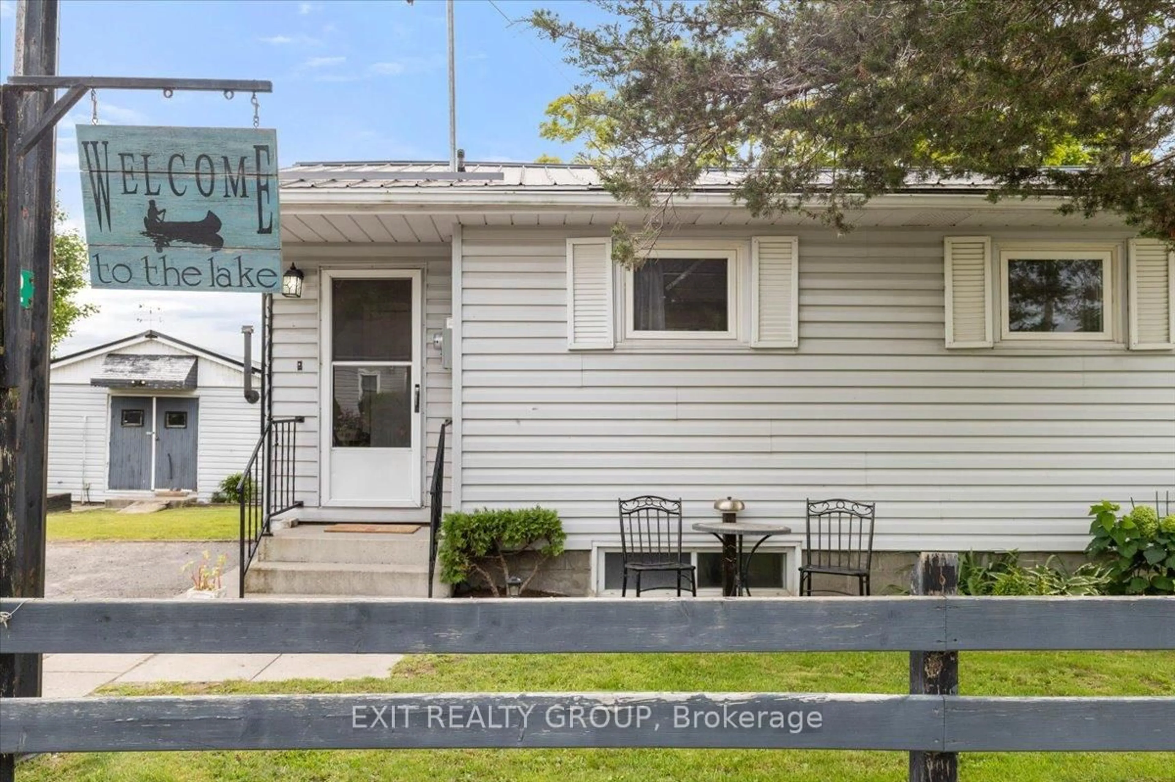 Home with vinyl exterior material, street for 82 Outlet Rd, Prince Edward County Ontario K0K 1P0