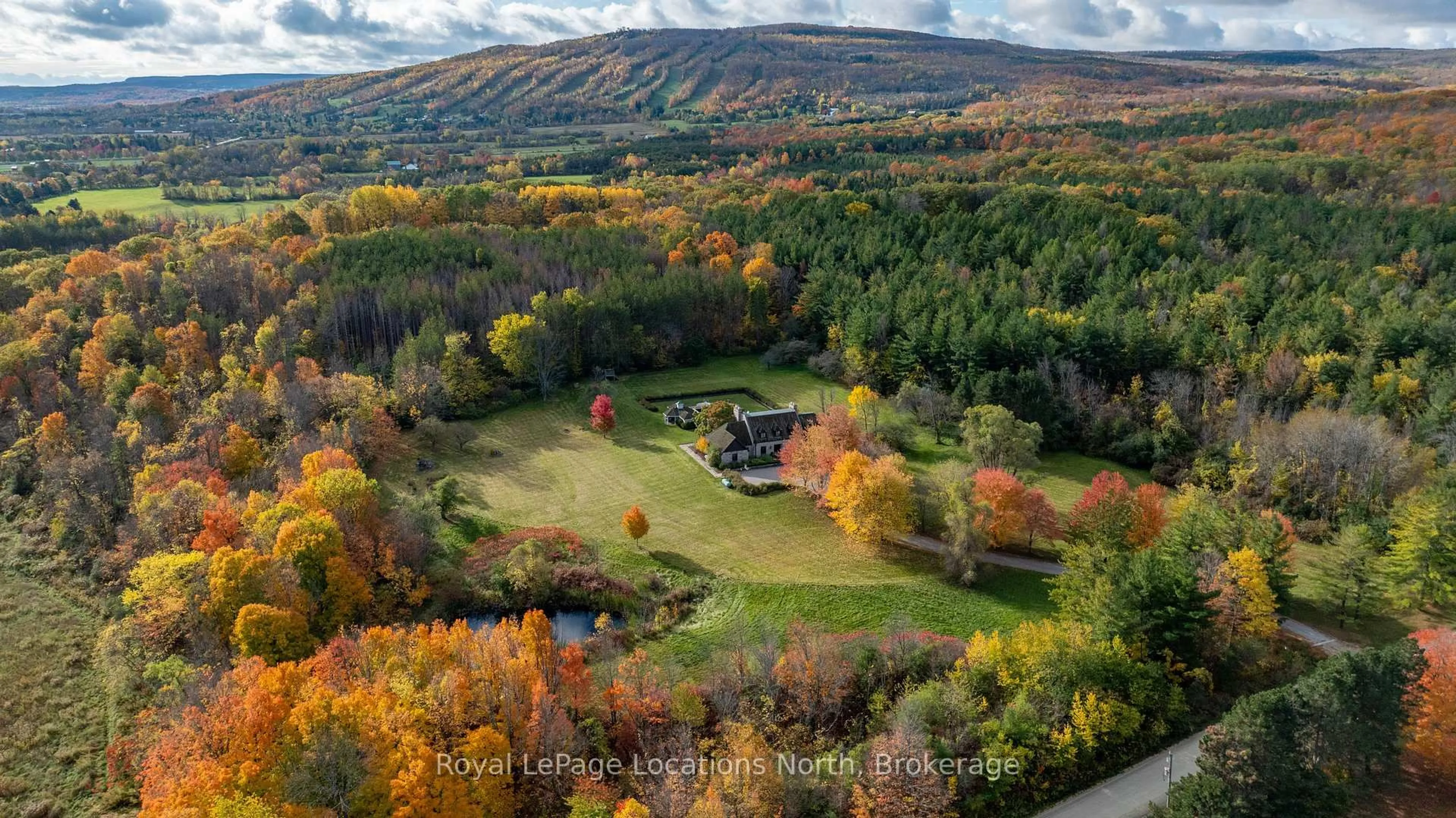 A pic from outside/outdoor area/front of a property/back of a property/a pic from drone, mountain view for 609830 12th Sdrd, Blue Mountains Ontario L9Y 0P6