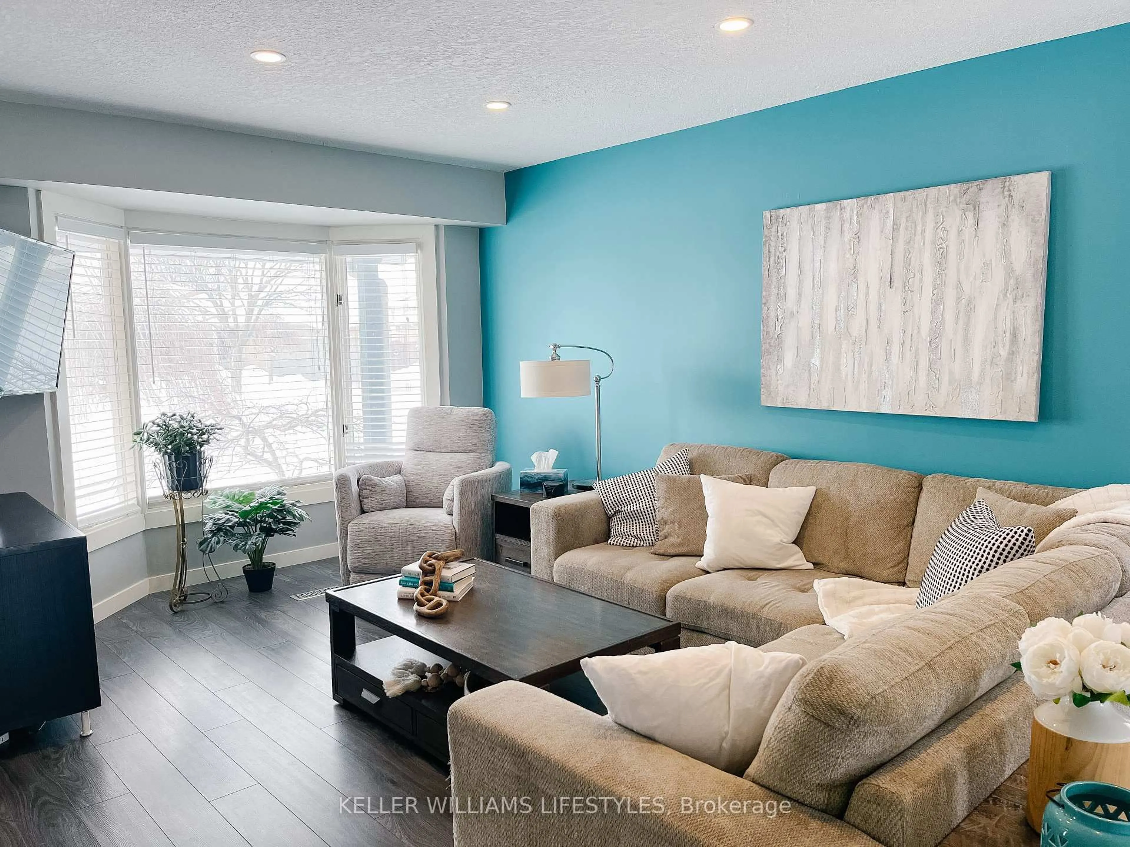 Living room with furniture, wood/laminate floor for 291 Conway Dr, London South Ontario N6E 3J6